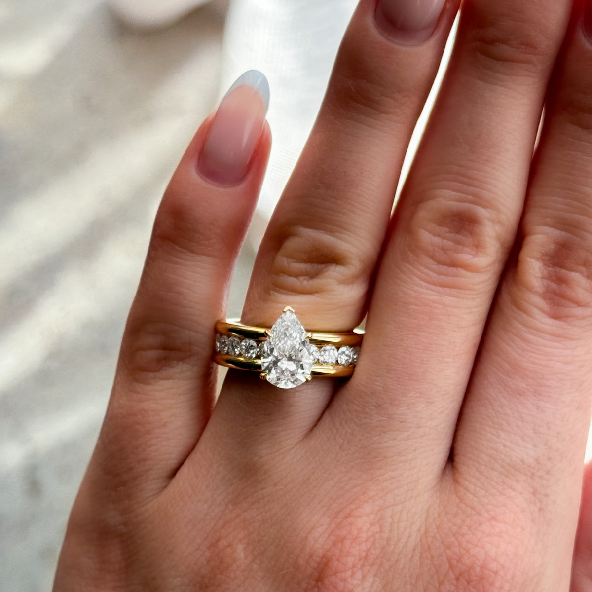Chunky Channel Set Engagement Ring with Pear Cut Diamond