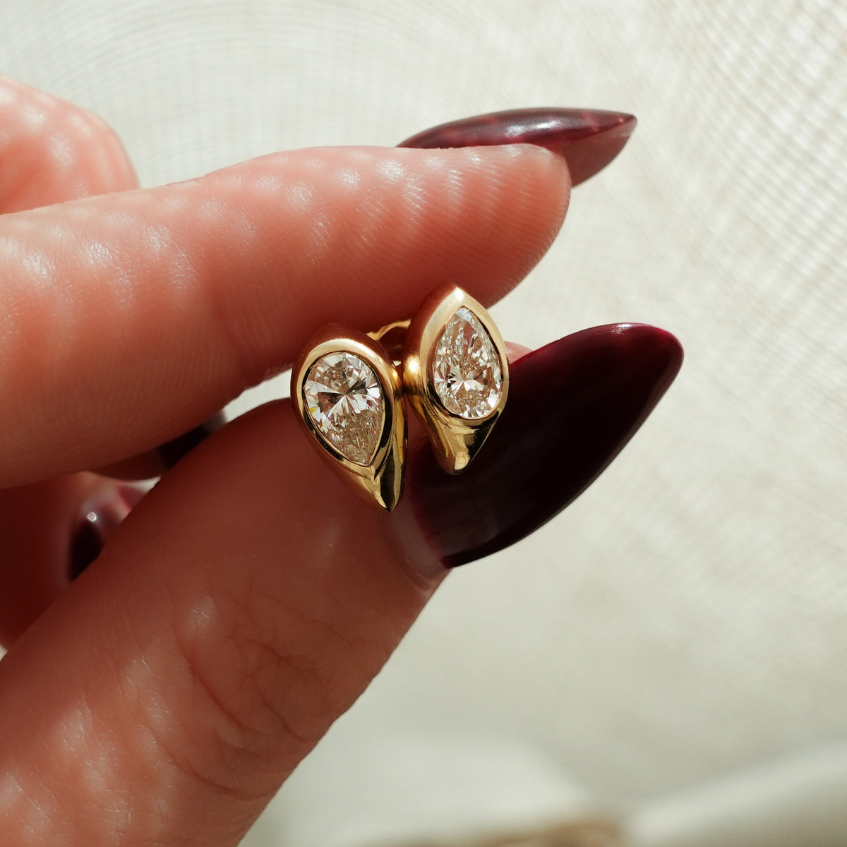 Sculpted Bezel Studs with Pear Cut Diamonds