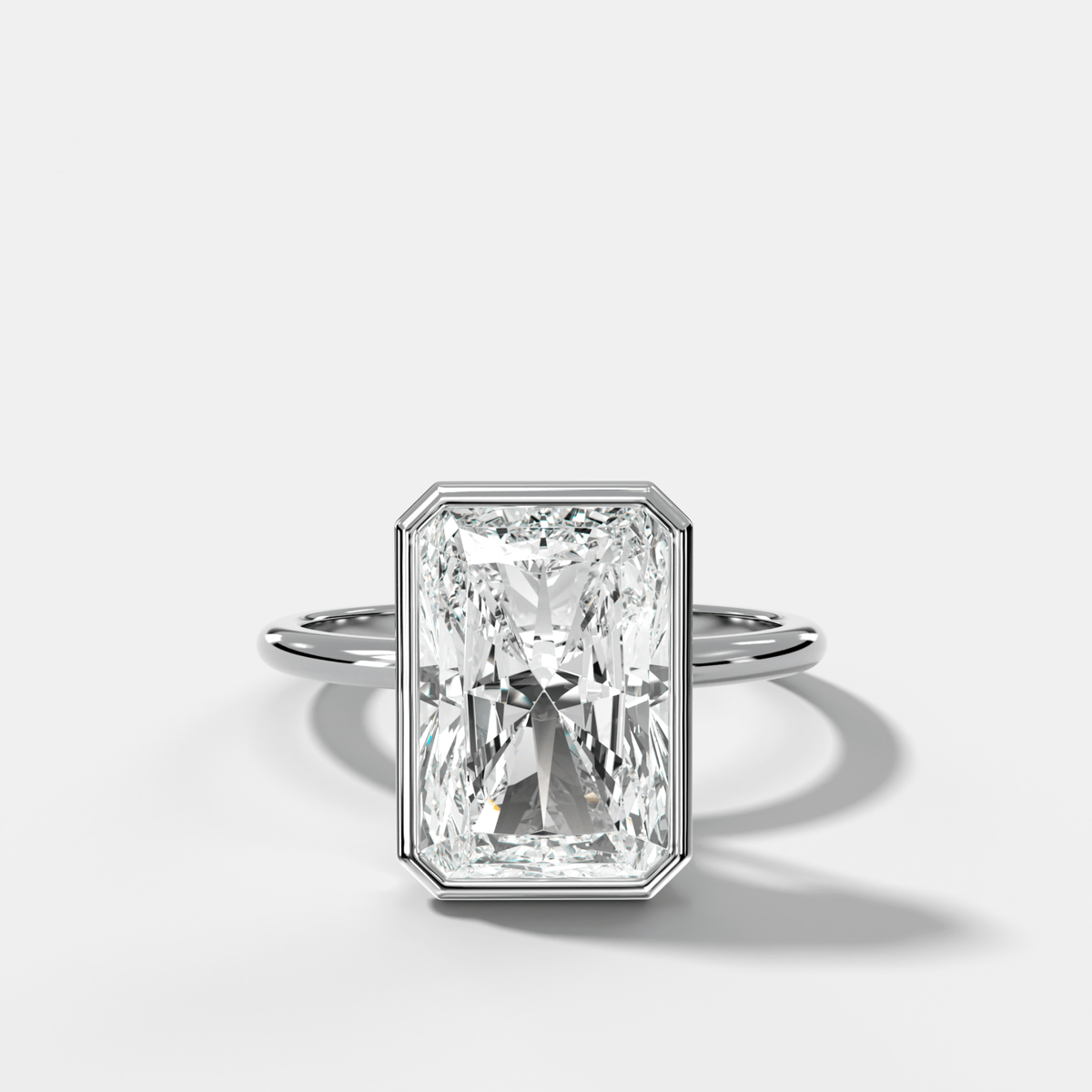 Penumbra Bezel Hidden Halo Engagement Ring with Elongated Radiant Cut - GOODSTONE