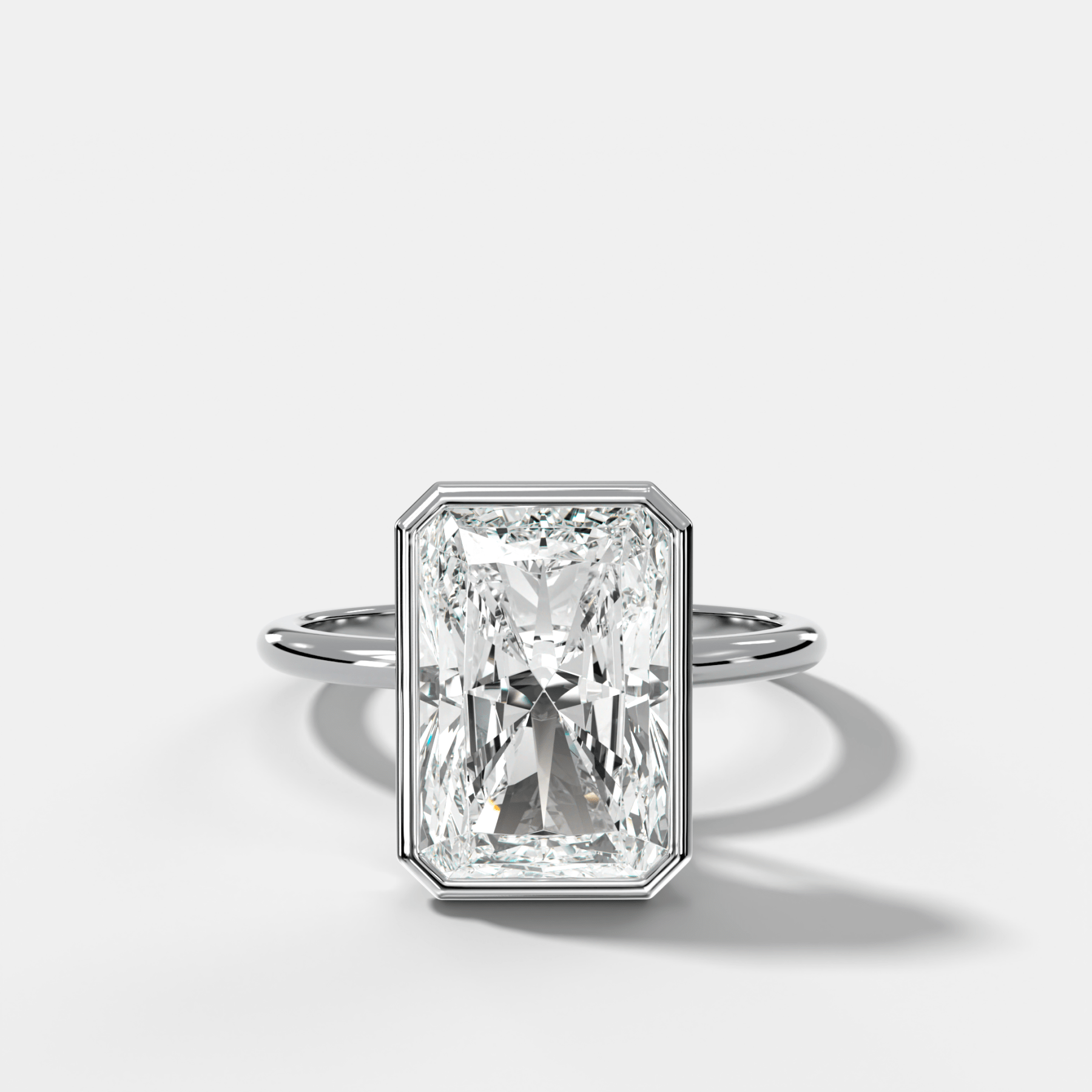Penumbra Bezel Hidden Halo Engagement Ring with Elongated Radiant Cut - GOODSTONE