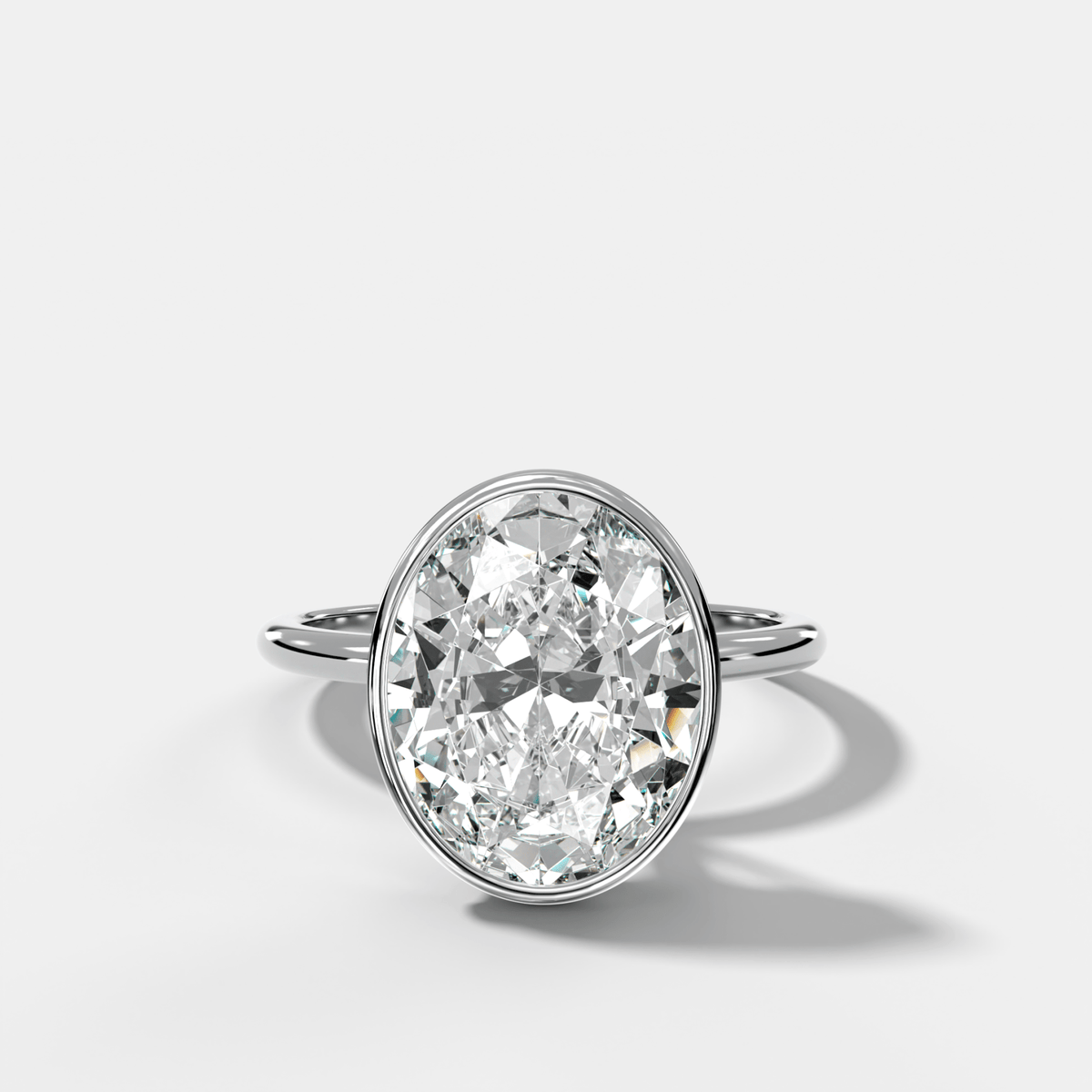 Penumbra Bezel Hidden Halo Engagement Ring with Oval Cut - GOODSTONE