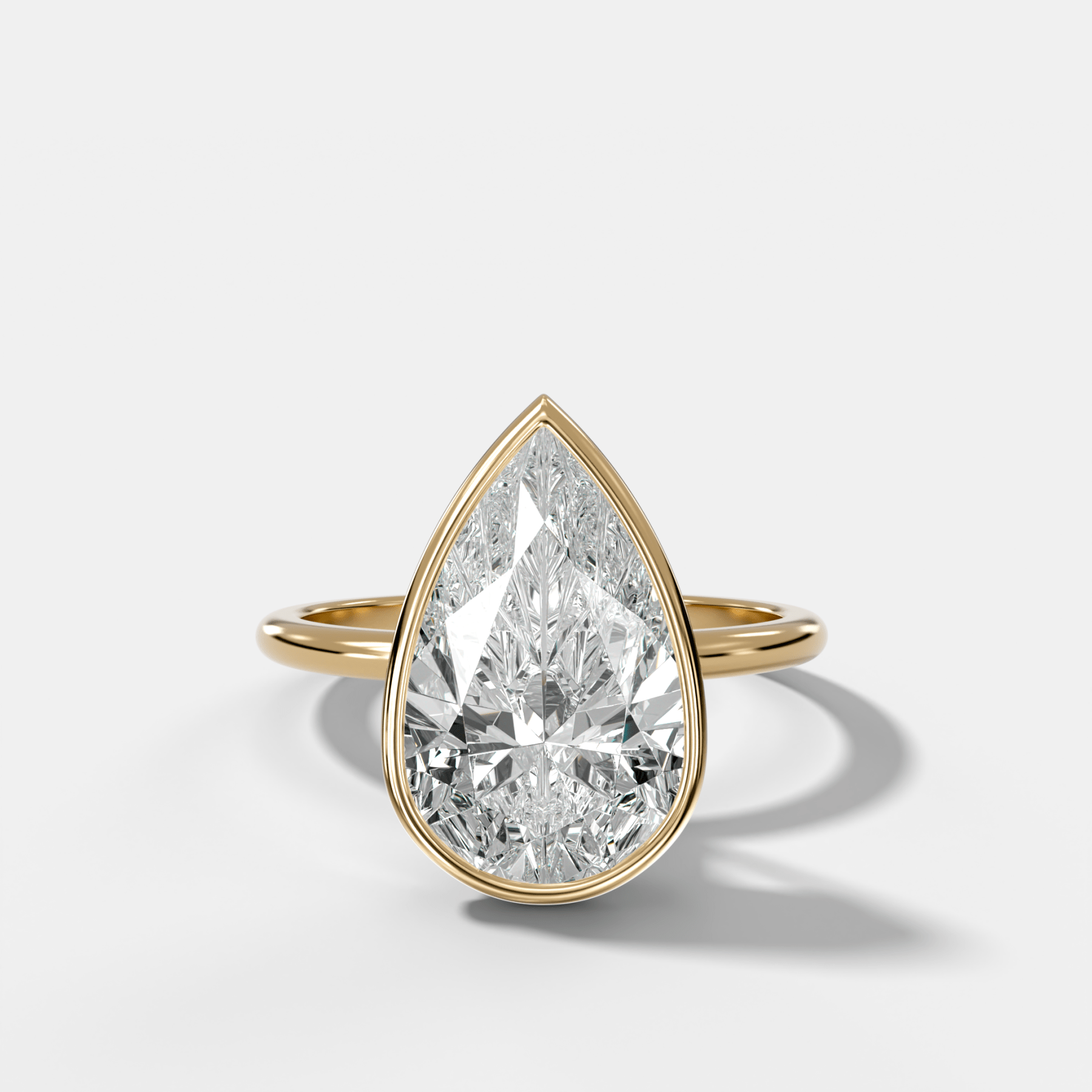 Penumbra Bezel Hidden Halo Engagement Ring with Pear Cut - GOODSTONE
