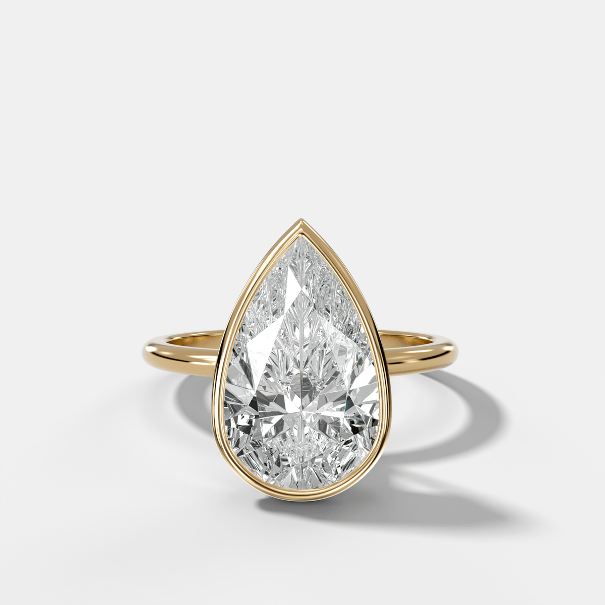 Penumbra Bezel Hidden Halo Engagement Ring with Pear Cut - GOODSTONE