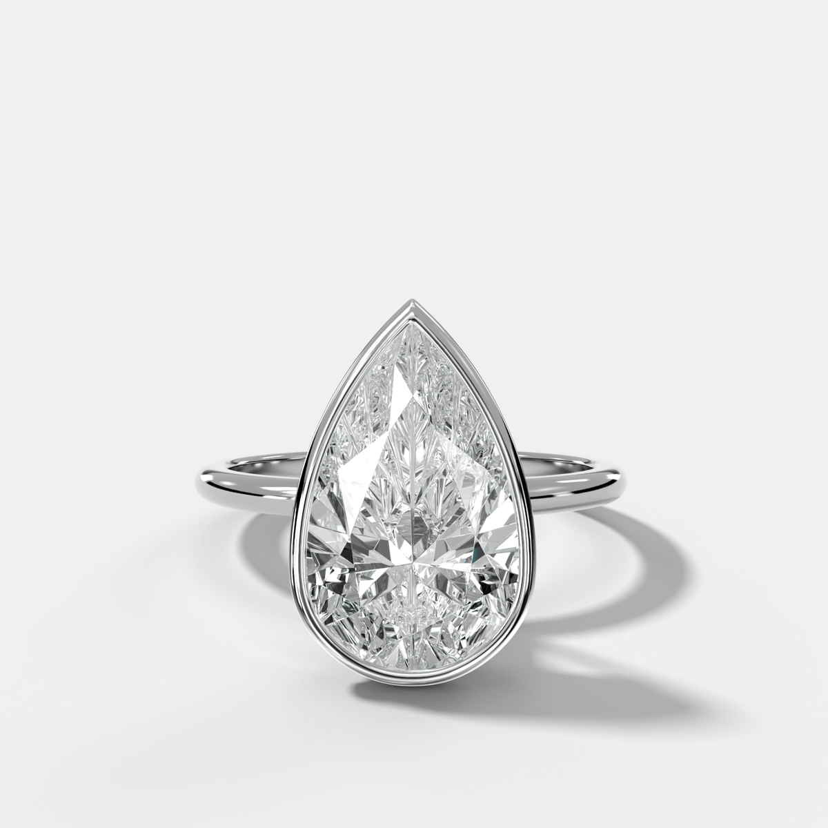 Penumbra Bezel Hidden Halo Engagement Ring with Pear Cut - GOODSTONE
