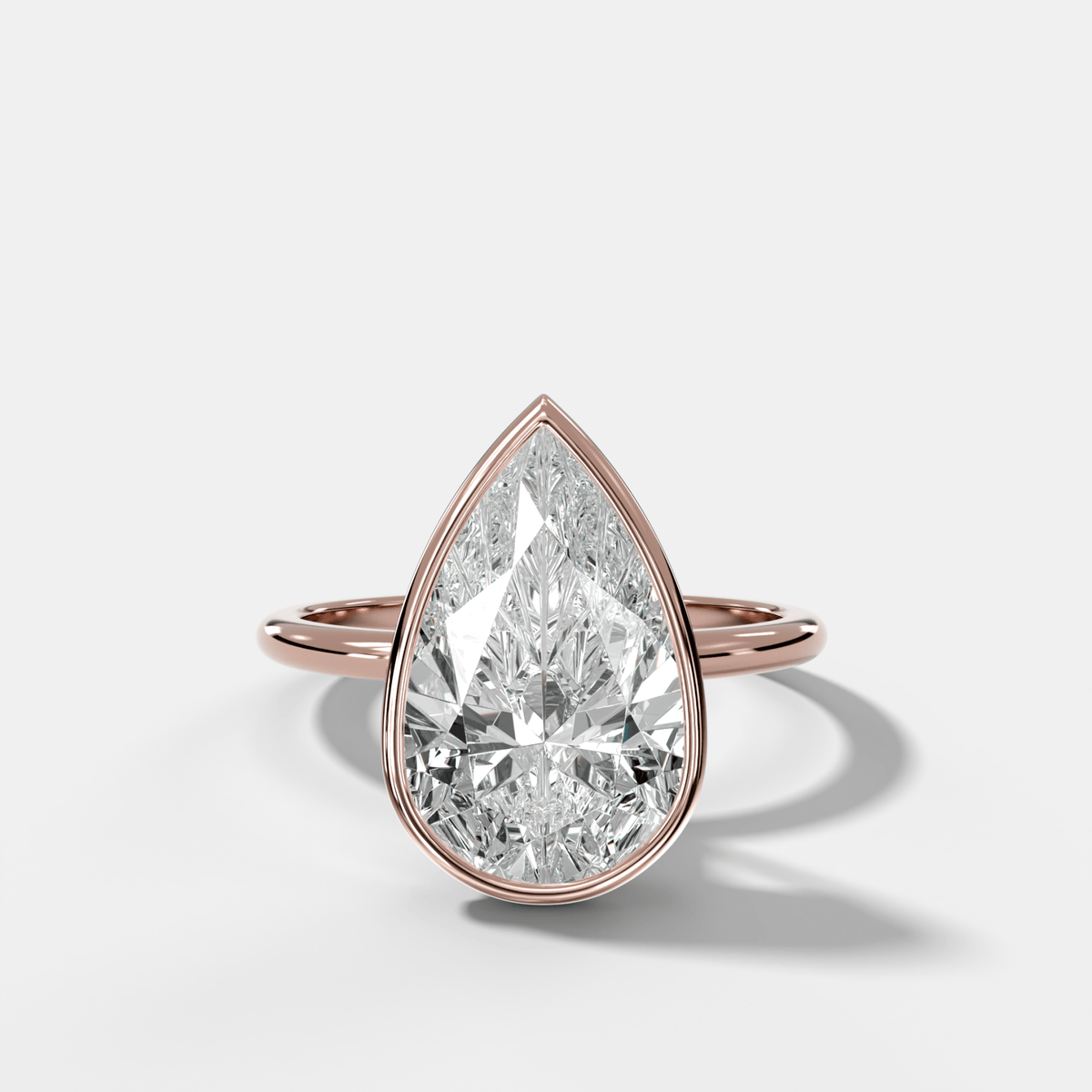 Penumbra Bezel Hidden Halo Engagement Ring with Pear Cut - GOODSTONE