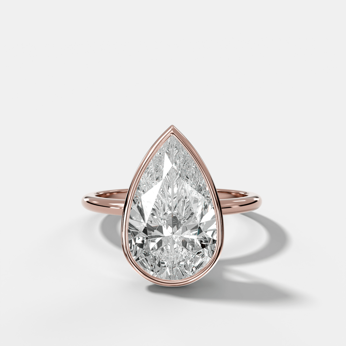 Penumbra Bezel Hidden Halo Engagement Ring with Pear Cut - GOODSTONE