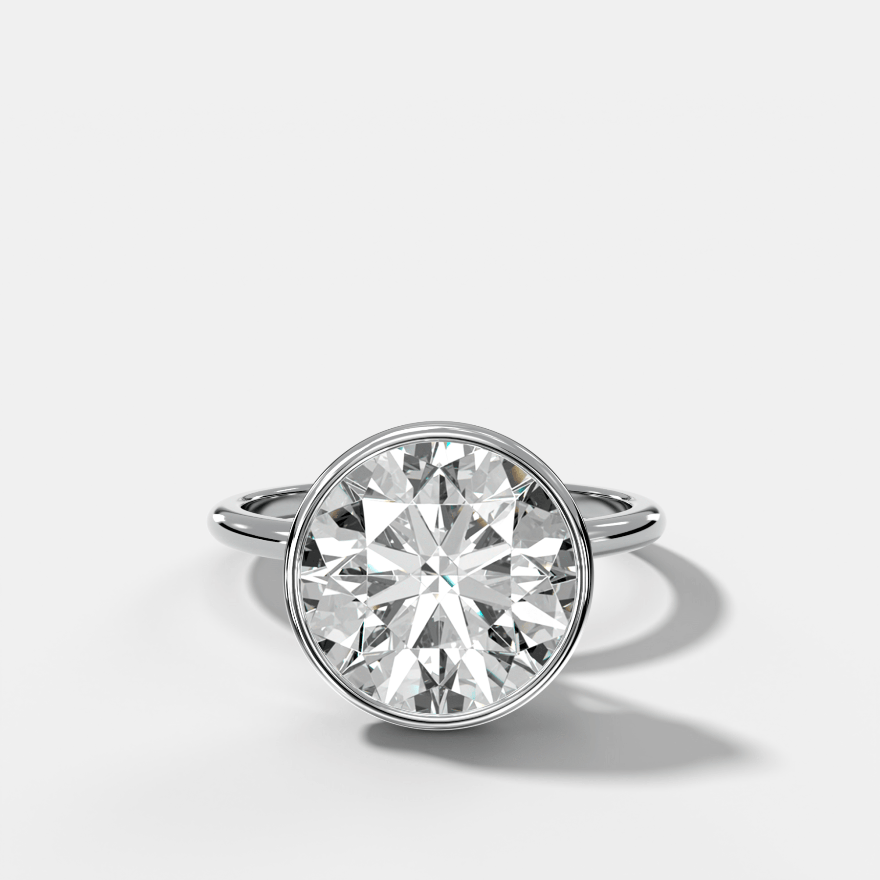 Penumbra Bezel Hidden Halo Engagement Ring with Round Cut - GOODSTONE