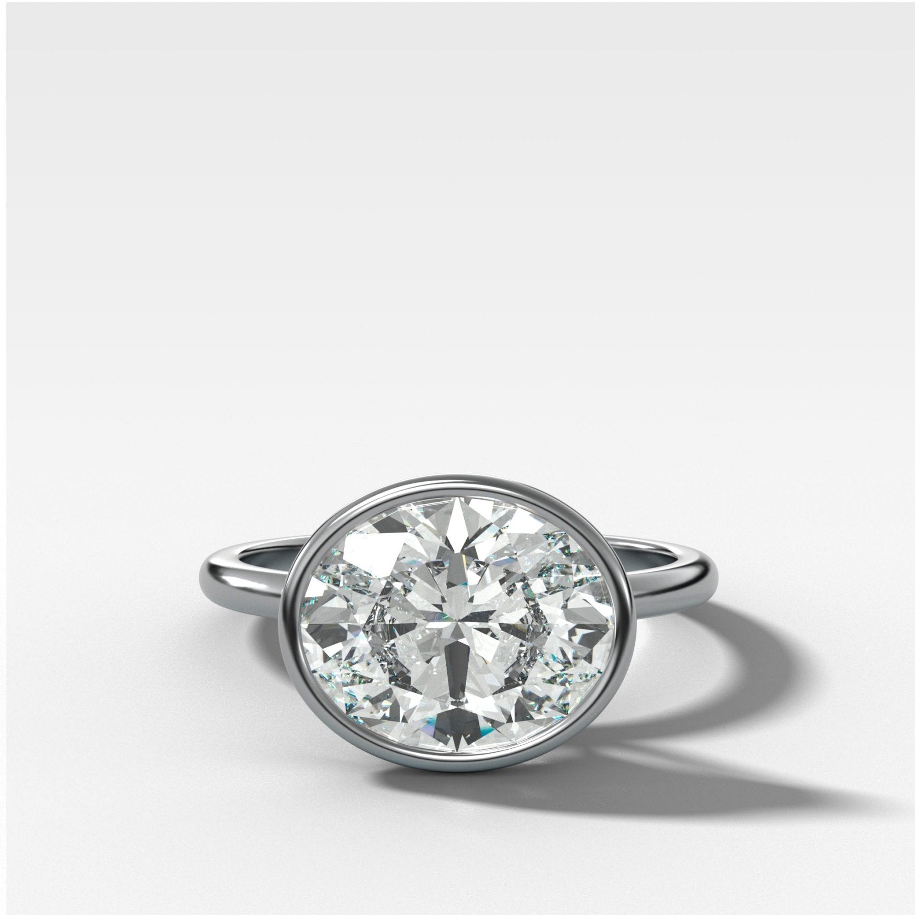 Penumbra Bezel Set Engagement Ring With East West Oval Cut - GOODSTONE