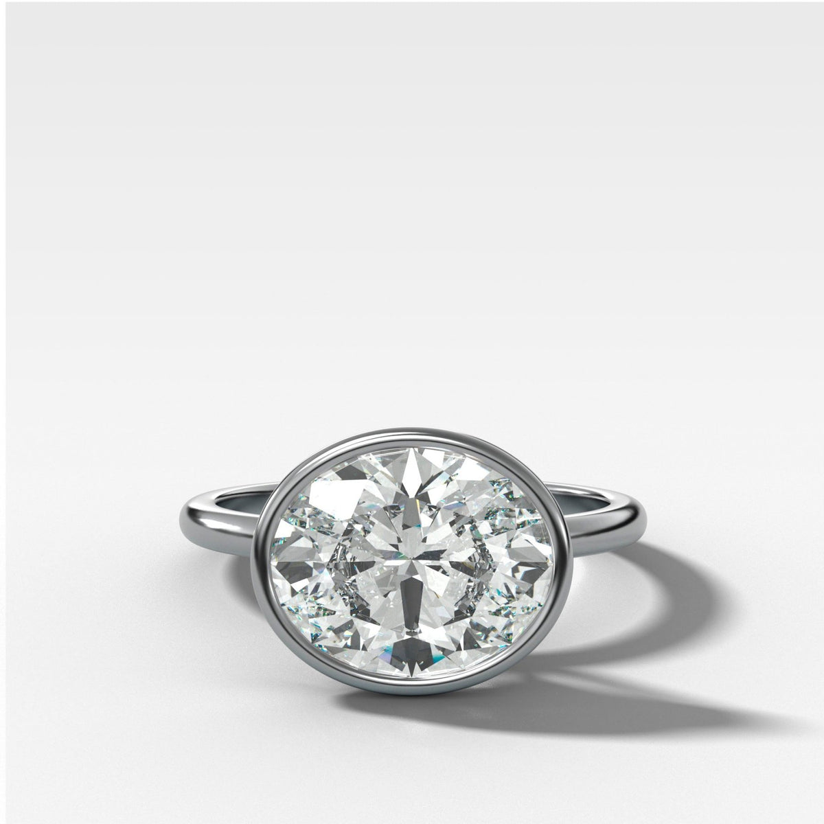 Penumbra Bezel Set Engagement Ring With East West Oval Cut - GOODSTONE