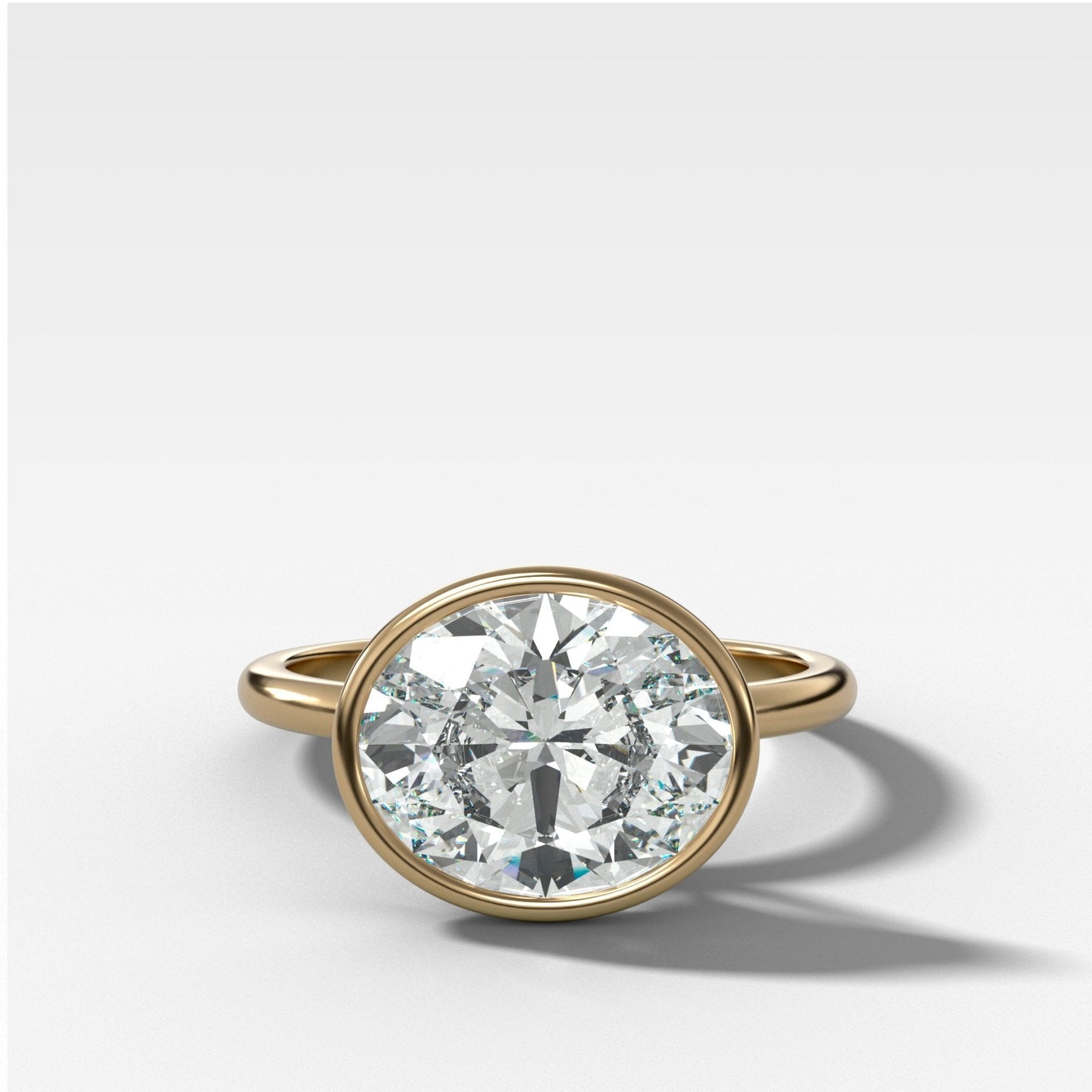 Penumbra Bezel Set Engagement Ring With East West Oval Cut - GOODSTONE