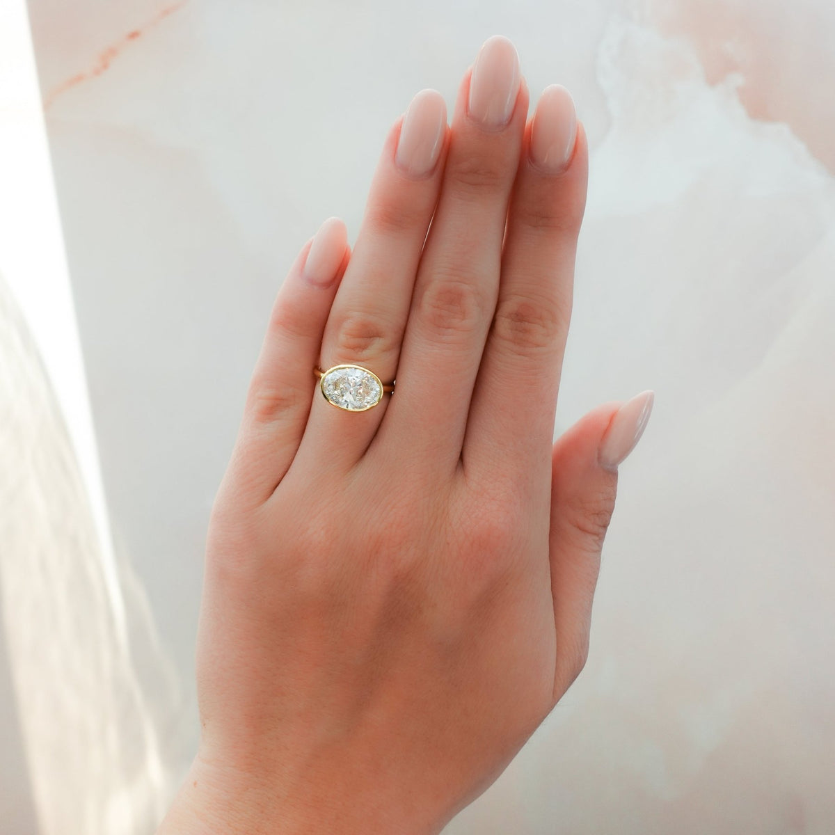 Penumbra Bezel Set Engagement Ring With East West Oval Cut - GOODSTONE