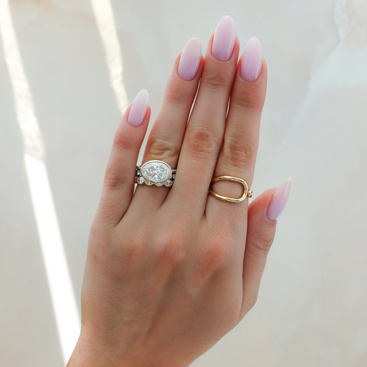 Penumbra Bezel Set Engagement Ring With East West Oval Cut - GOODSTONE