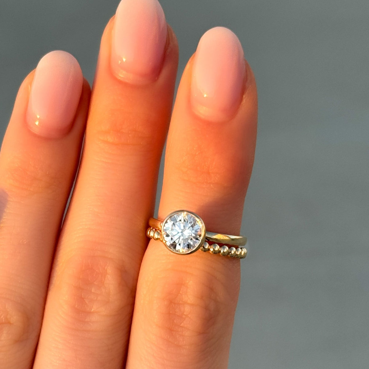 Penumbra Bezel Set Engagement Ring With Round Cut - GOODSTONE