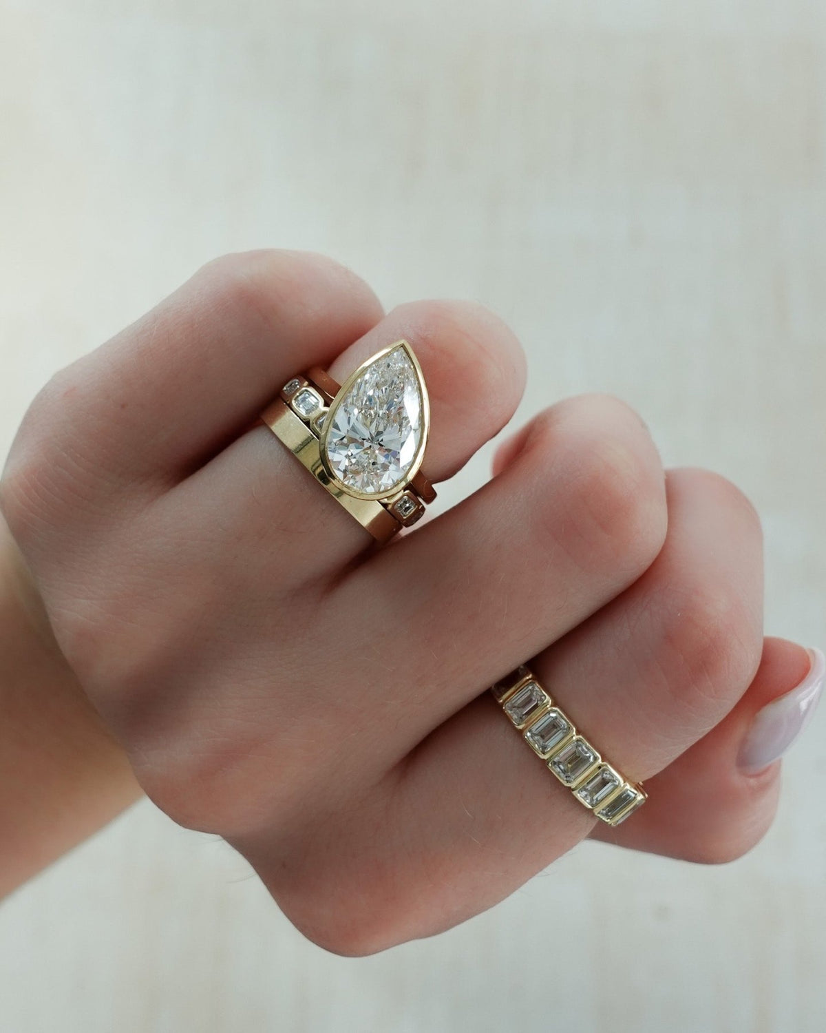 Penumbra Bezel Set Engagement Ring With Tilted Pear Cut - GOODSTONE