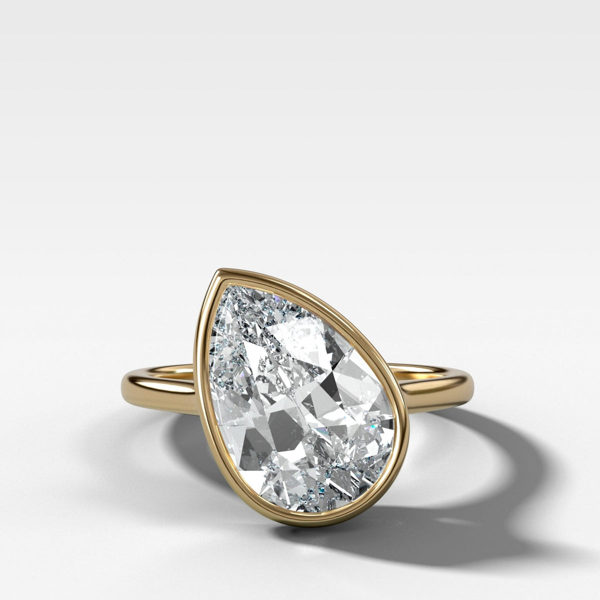 Penumbra Bezel Set Engagement Ring With Tilted Pear Cut - GOODSTONE