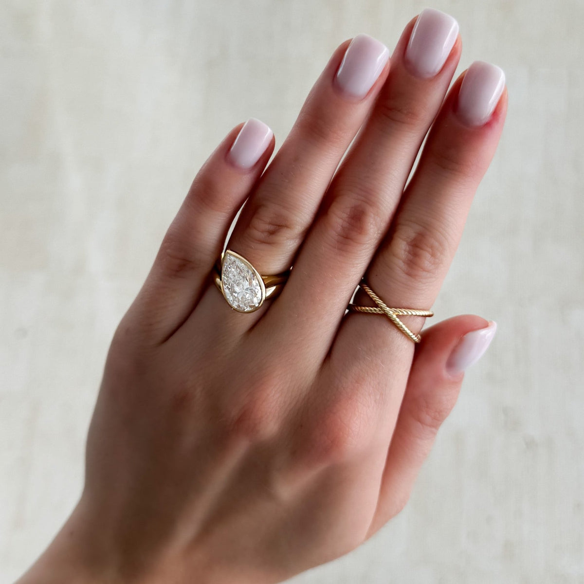 Penumbra Bezel Set Engagement Ring With Tilted Pear Cut - GOODSTONE