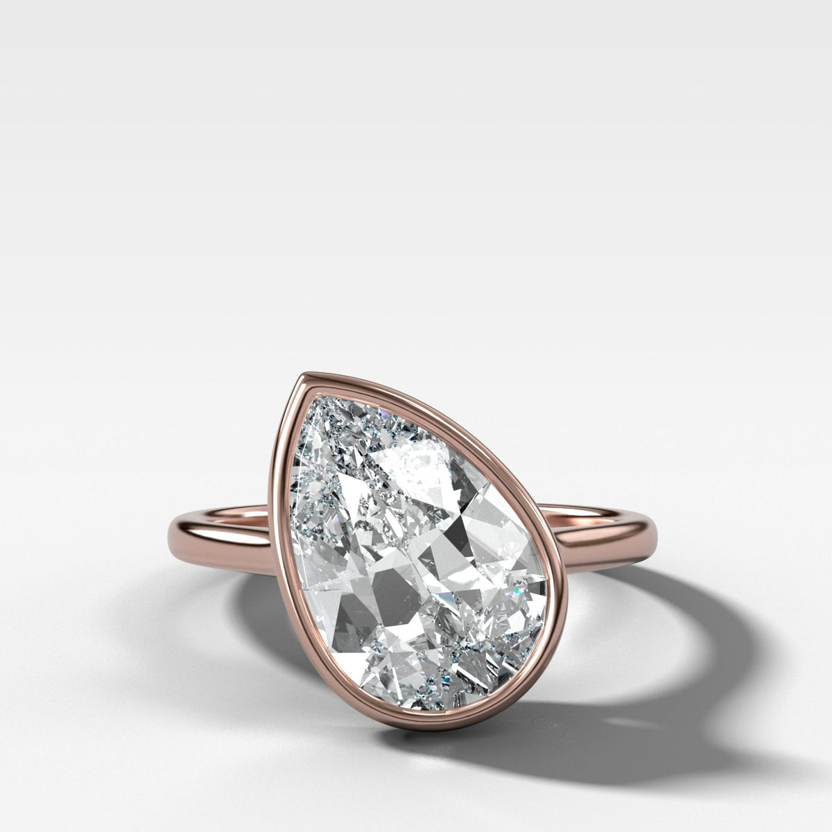 Penumbra Bezel Set Engagement Ring With Tilted Pear Cut - GOODSTONE