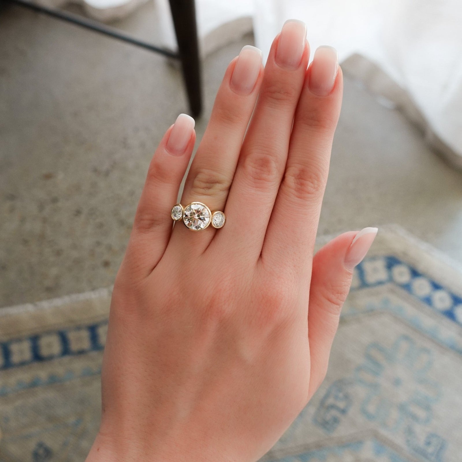 Penumbra Bezel Triad Engagement Ring With 3.14ct Lab Grown Round Cut Diamond - GOODSTONE