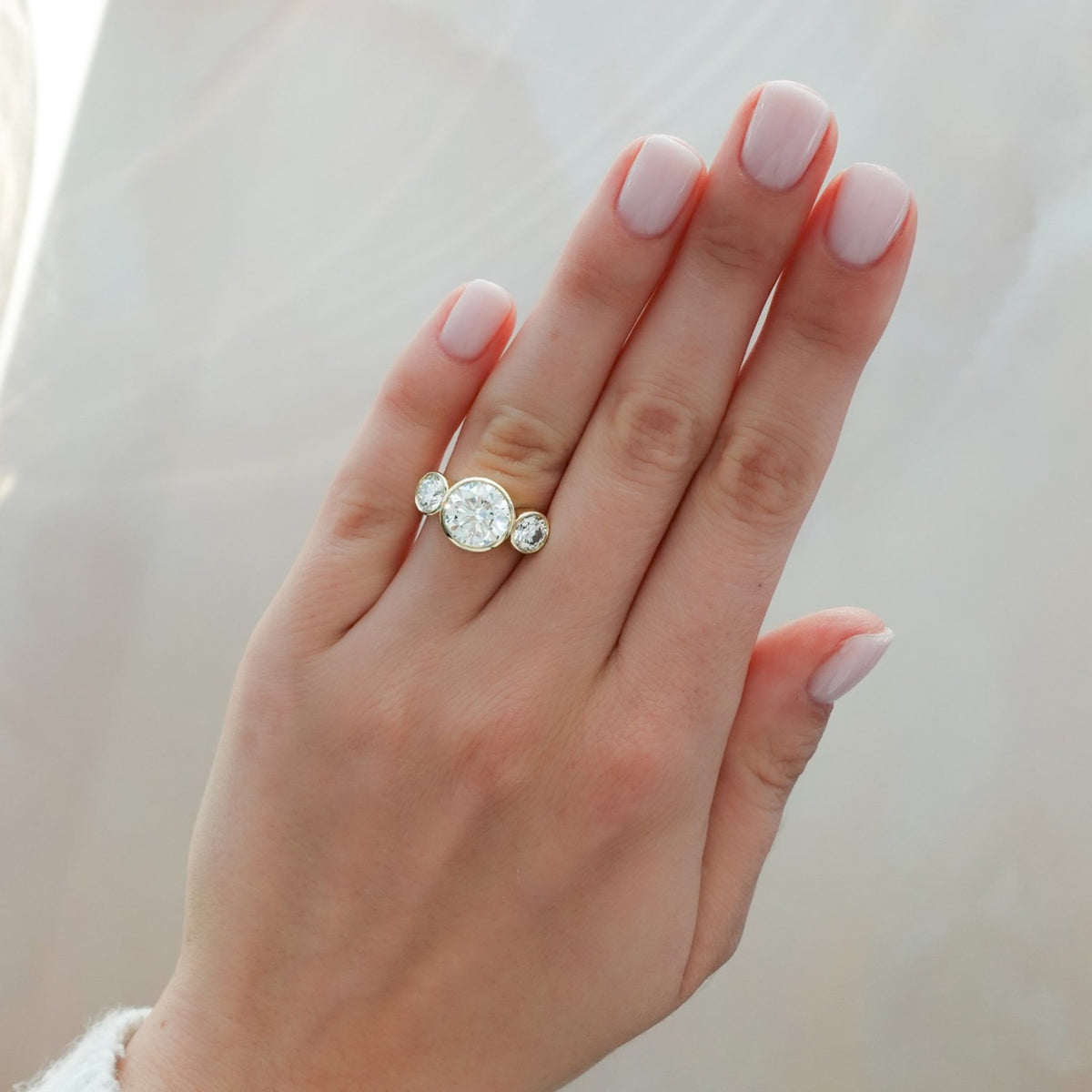 Penumbra Bezel Triad Engagement Ring With 3.14ct Lab Grown Round Cut Diamond - GOODSTONE