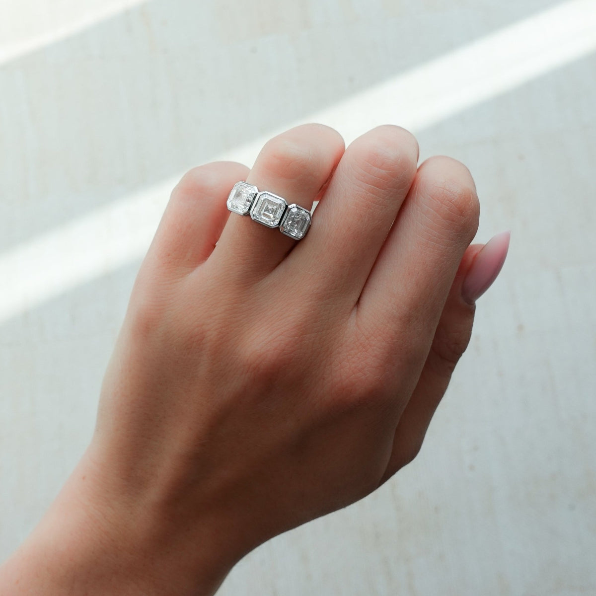 Penumbra Bezel Triad Engagement Ring With Asscher Cut Diamonds - GOODSTONE