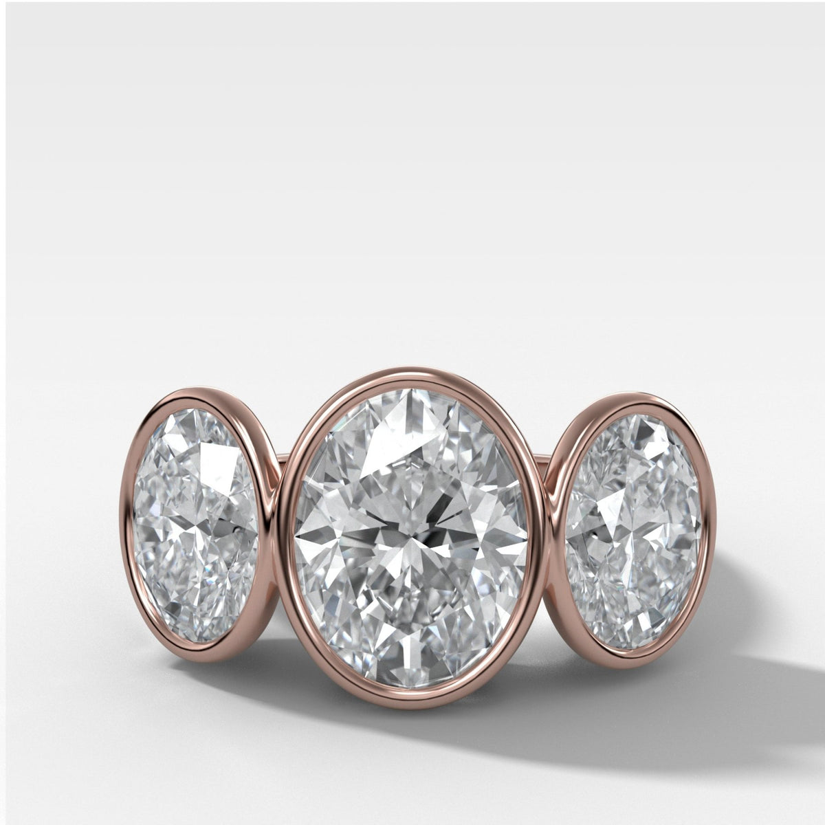 Penumbra Bezel Triad Engagement Ring With Oval Cut Diamonds - GOODSTONE