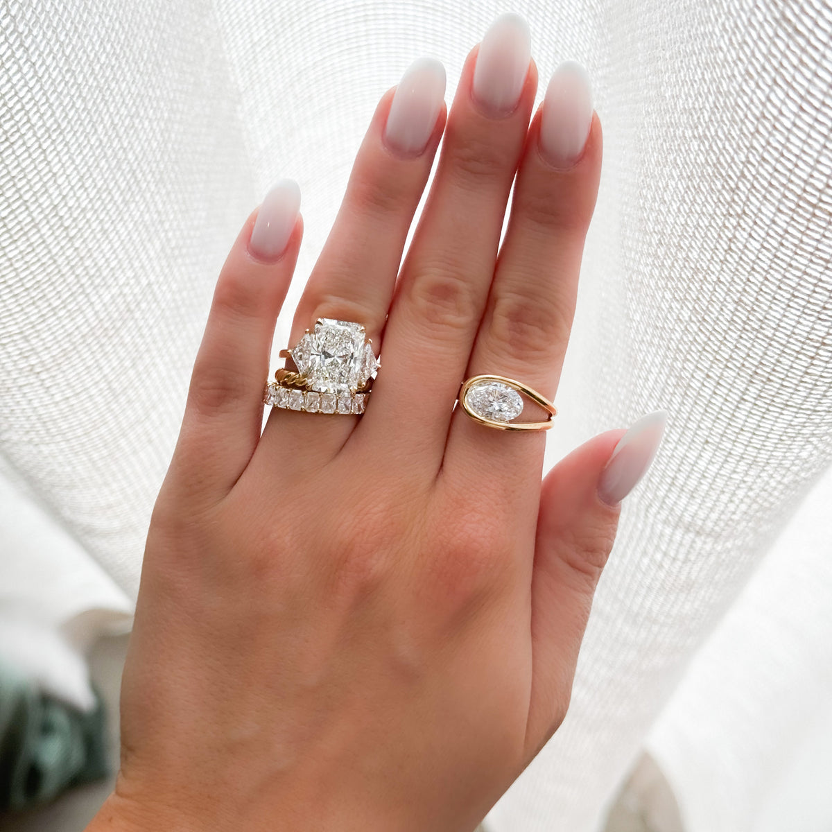 Three Stone Engagement Ring with Shield Side Stones and an Elongated Radiant cut Diamond