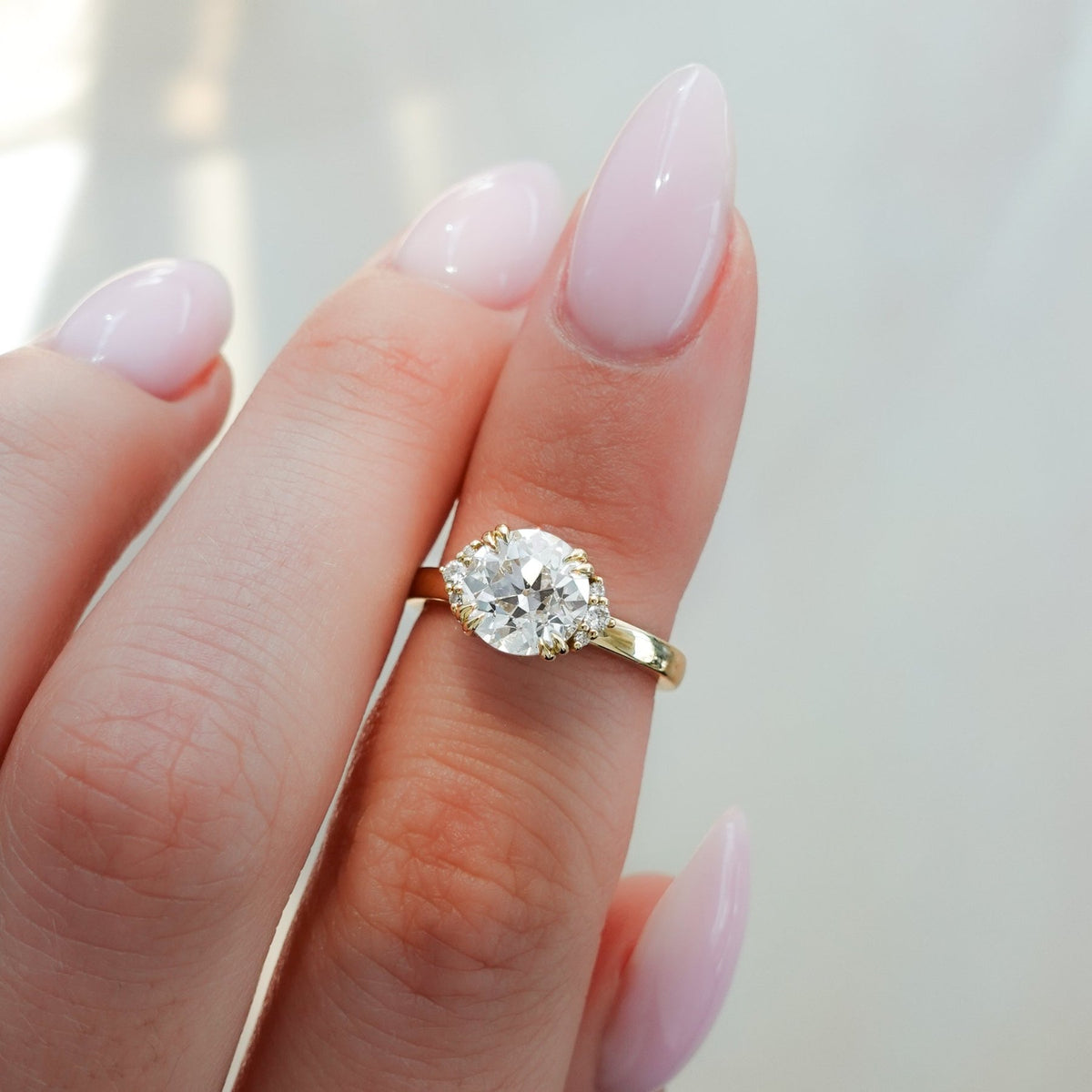 Signature Cluster Engagement Ring With Round Cut Diamond - GOODSTONE