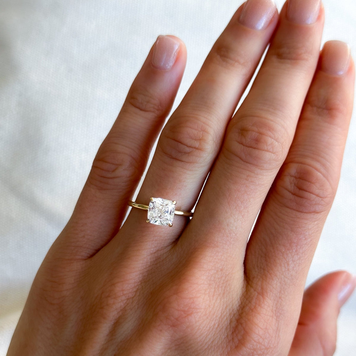 Thin + Simple Solitaire Engagement Ring With Cushion Cut Diamond - GOODSTONE