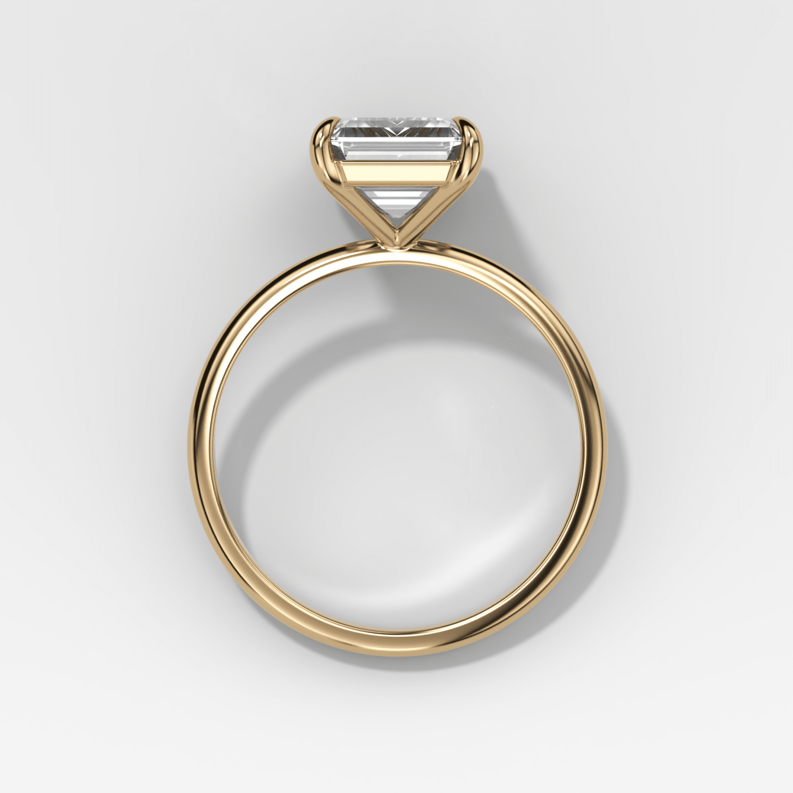 Solitario fino + simple con talla esmeralda de Good Stone en oro amarillo