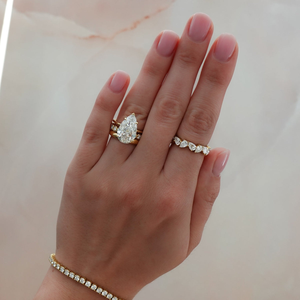 Thin + Simple Solitaire Engagement Ring With Pear Cut Diamond - GOODSTONE