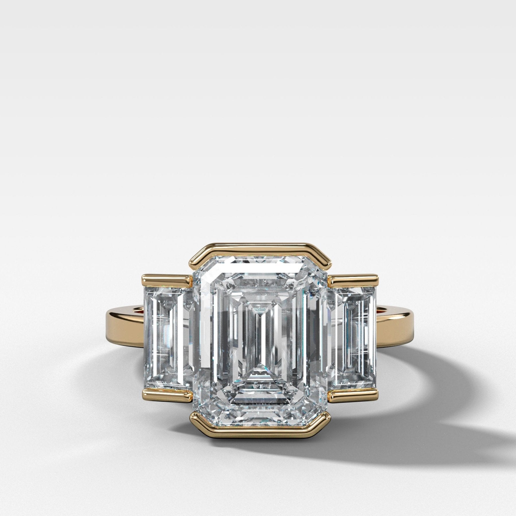 Three Stone Engagement Ring with Half Bezel Baguette Side Stones and Emerald Cut Diamond - GOODSTONE