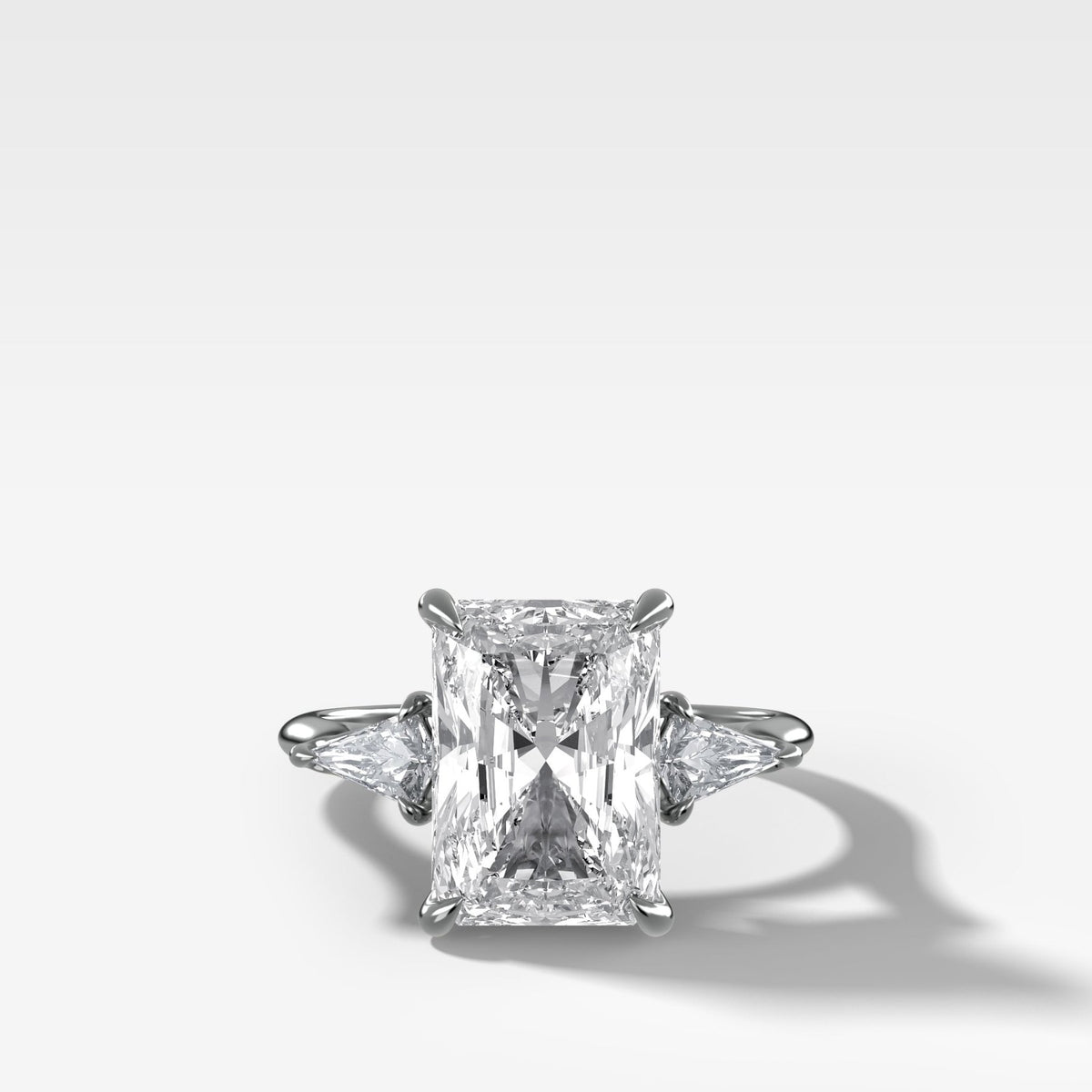 Three Stone Engagement Ring With Kite Side Stones and Elongated Radiant Cut Diamond - GOODSTONE