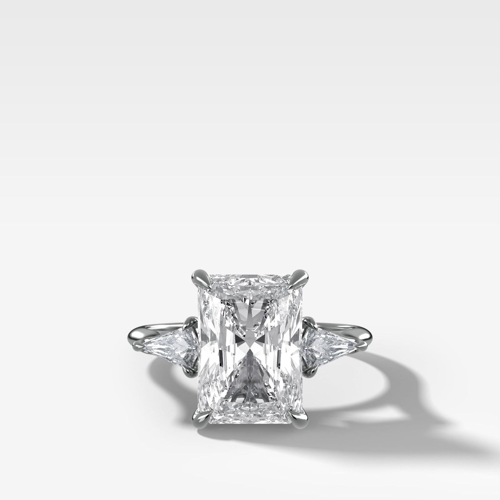 Three Stone Engagement Ring With Kite Side Stones and Elongated Radiant Cut Diamond - GOODSTONE
