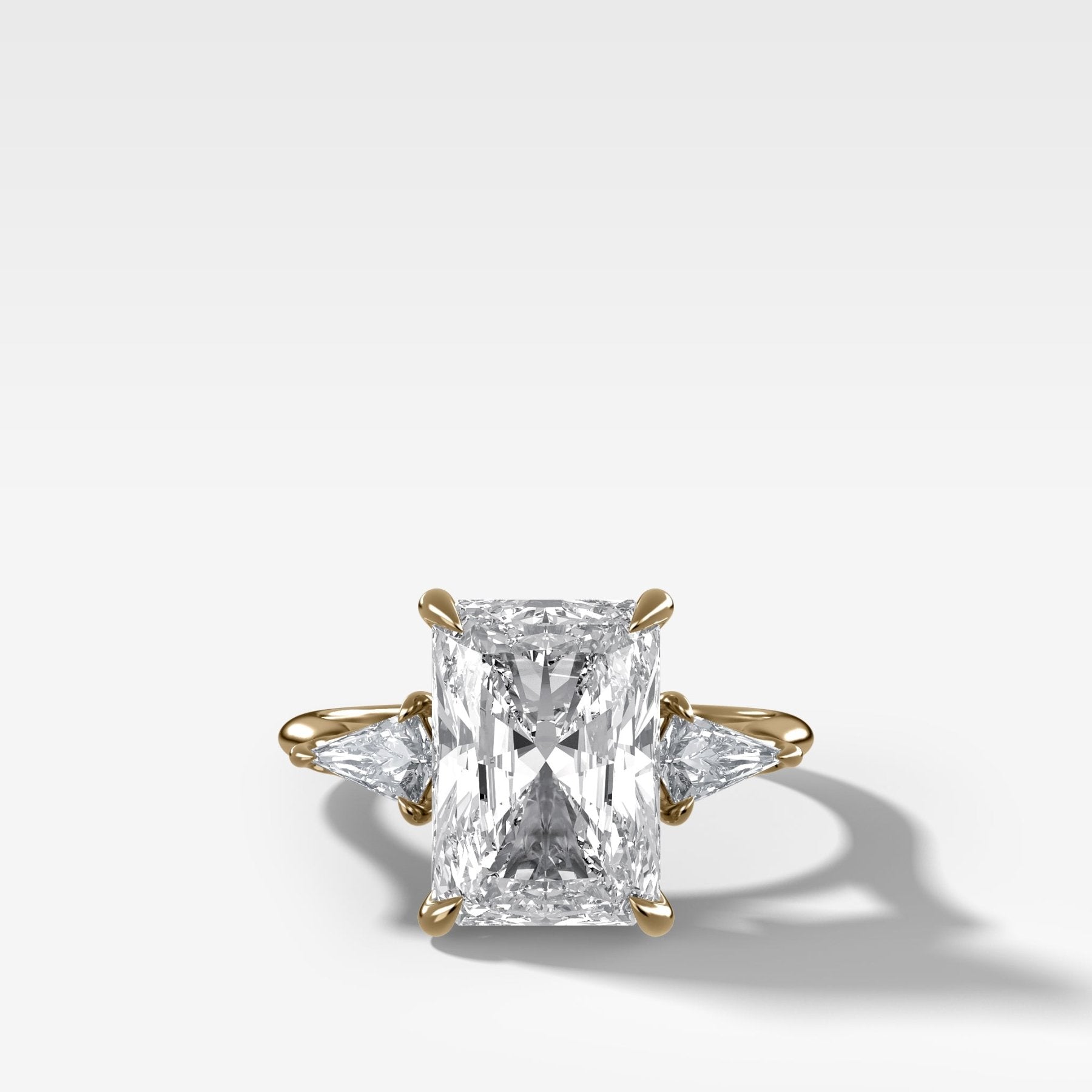 Three Stone Engagement Ring With Kite Side Stones and Elongated Radiant Cut Diamond - GOODSTONE