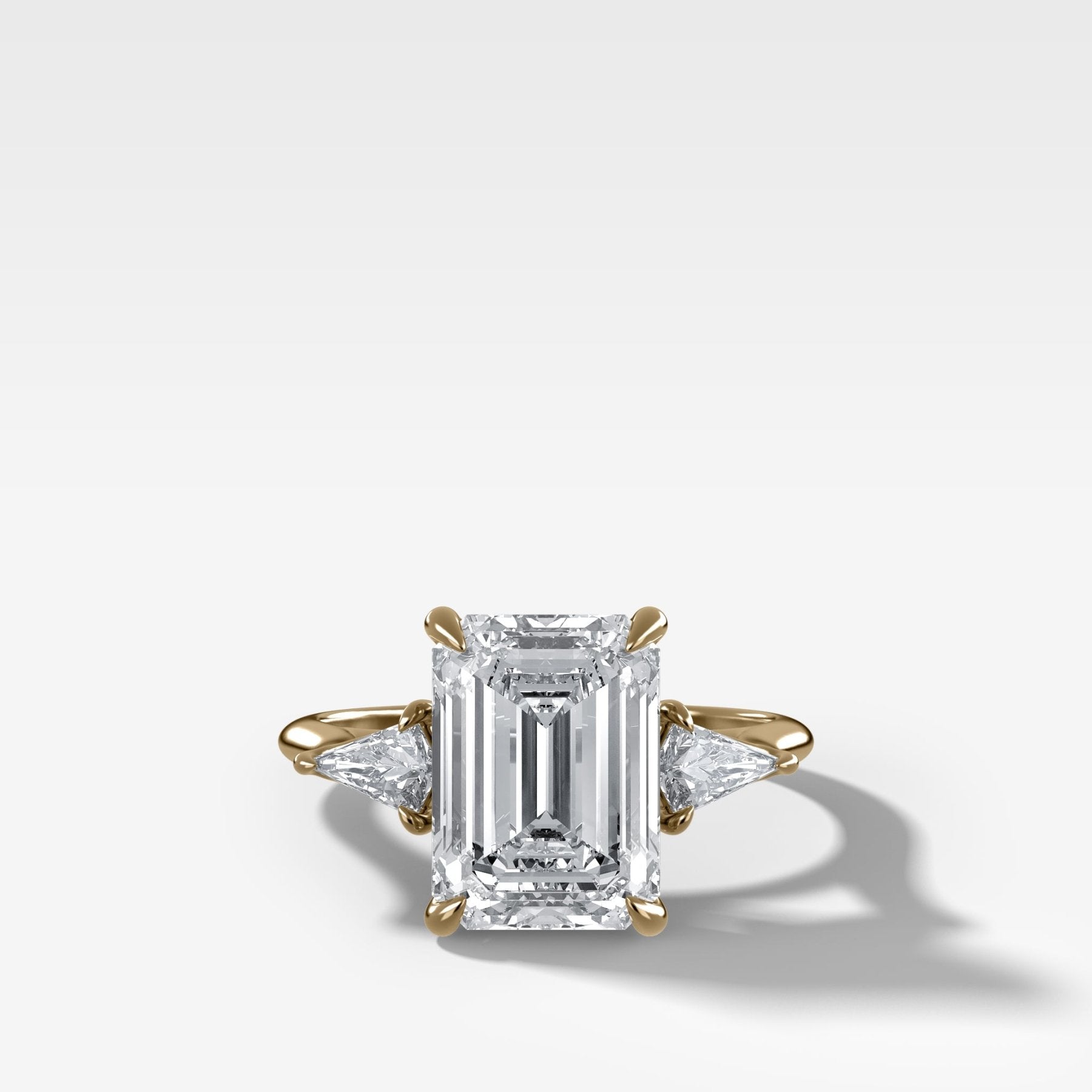 Three Stone Engagement Ring With Kite Side Stones and Emerald Cut Diamond - GOODSTONE