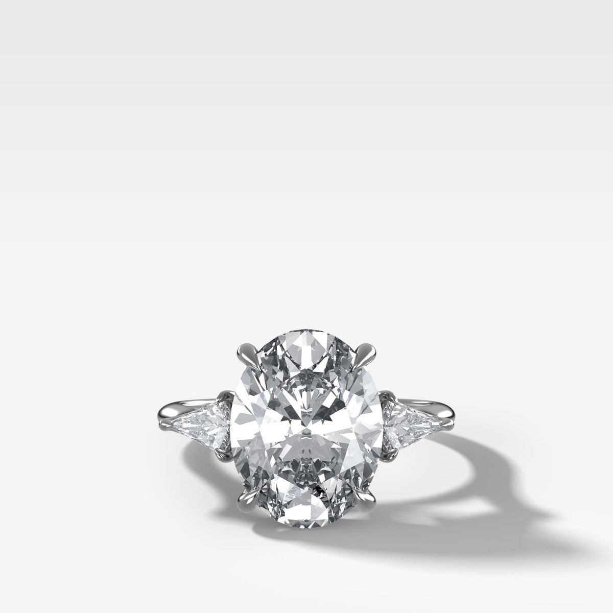 Three Stone Engagement Ring With Kite Side Stones and Oval Cut Diamond - GOODSTONE
