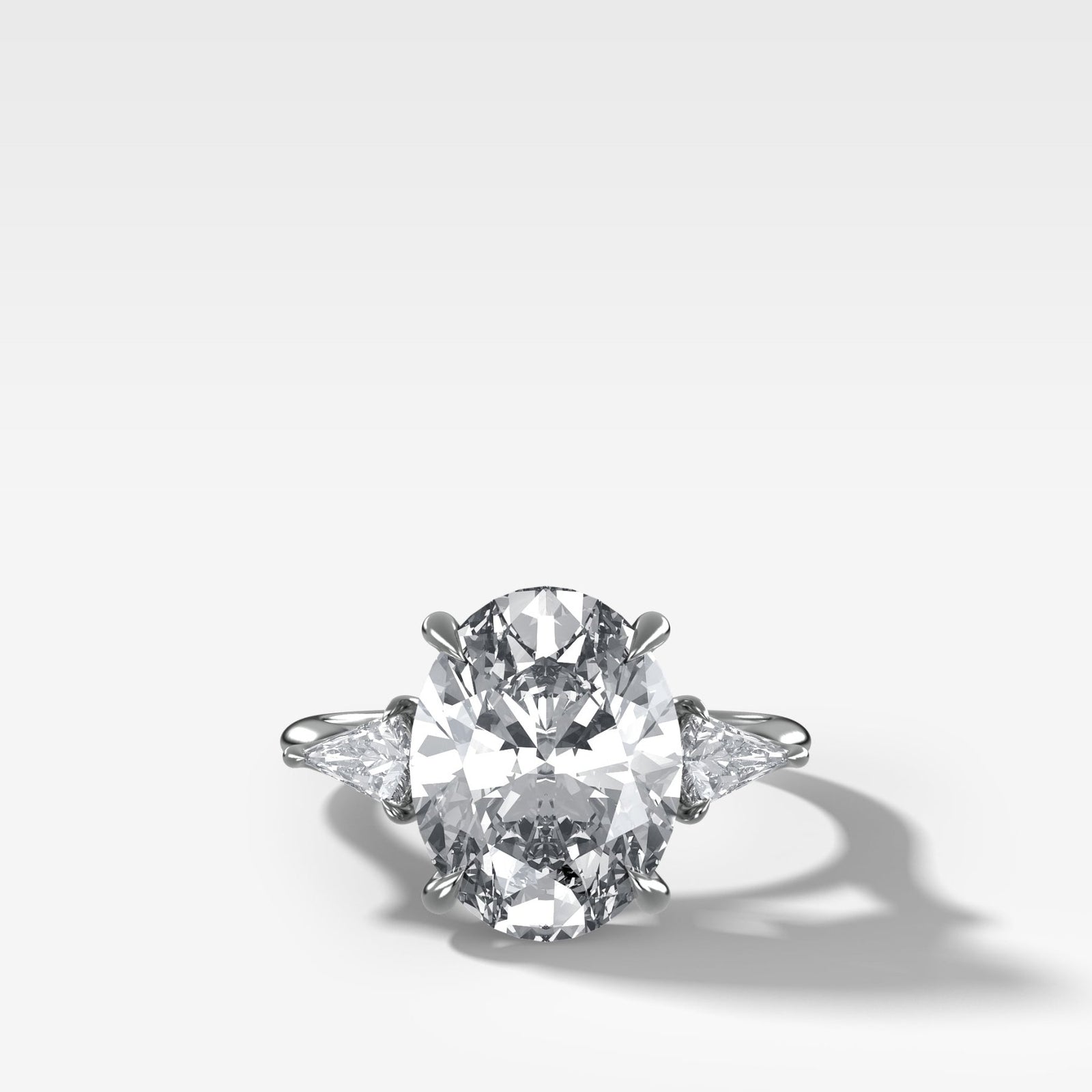 Three Stone Engagement Ring With Kite Side Stones and Oval Cut Diamond - GOODSTONE