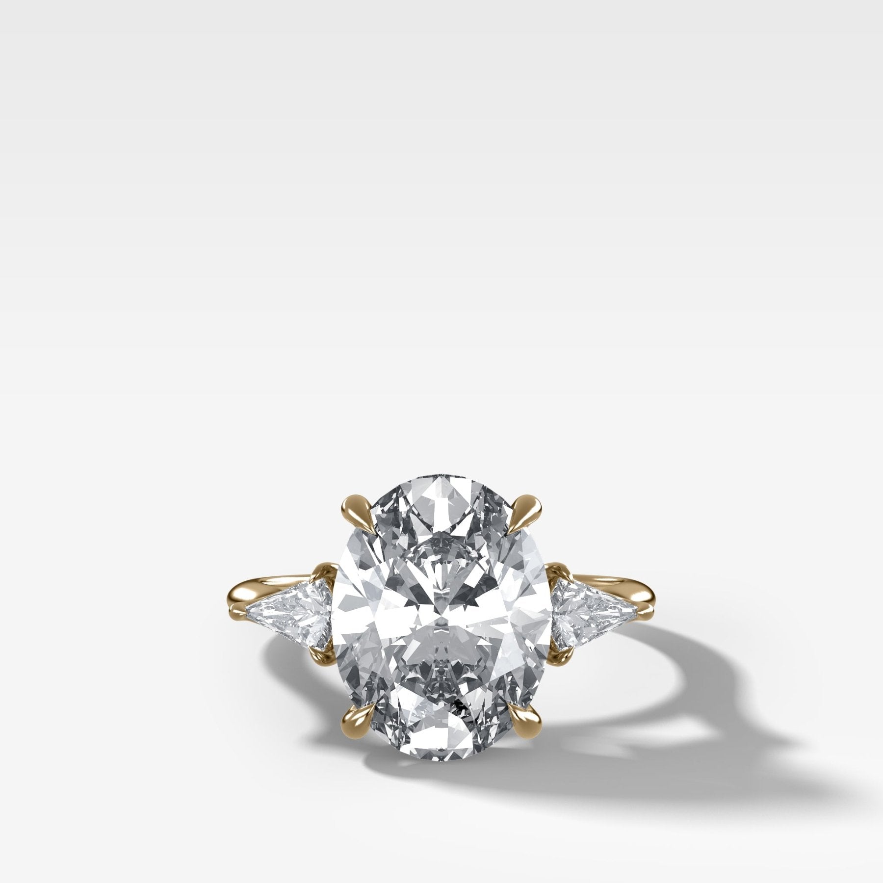 Three Stone Engagement Ring With Kite Side Stones and Oval Cut Diamond - GOODSTONE