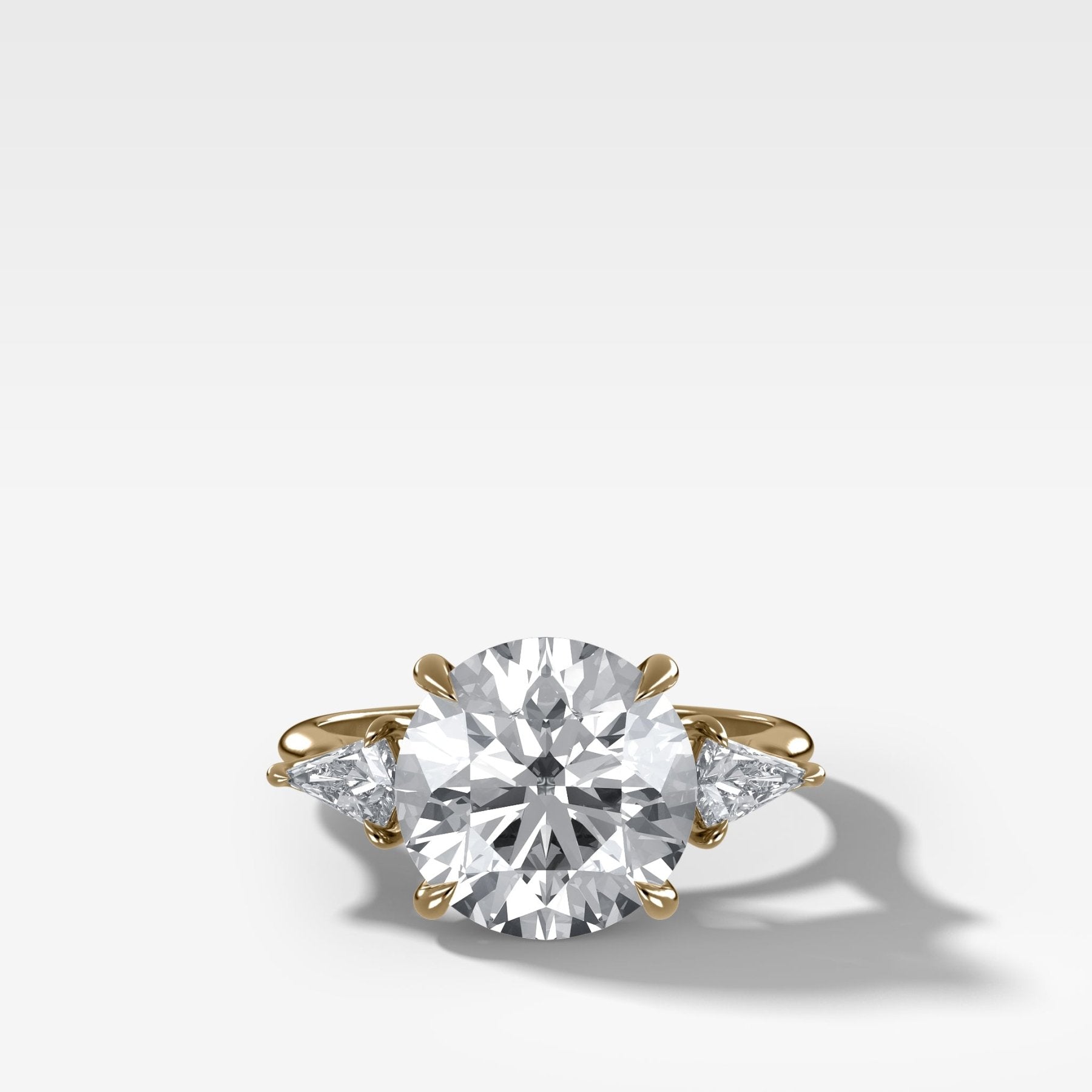 Three Stone Engagement Ring With Kite Side Stones and Round Cut Diamond - GOODSTONE