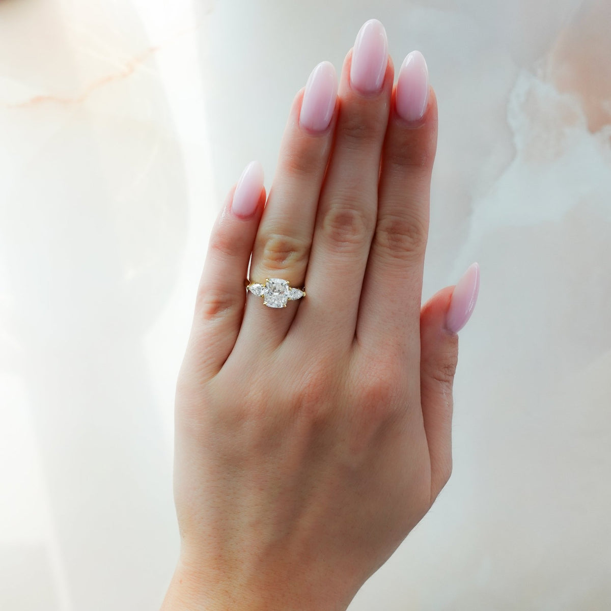 Three Stone Engagement Ring With Pear Side Stones and Elongated Cushion Cut Diamond - GOODSTONE