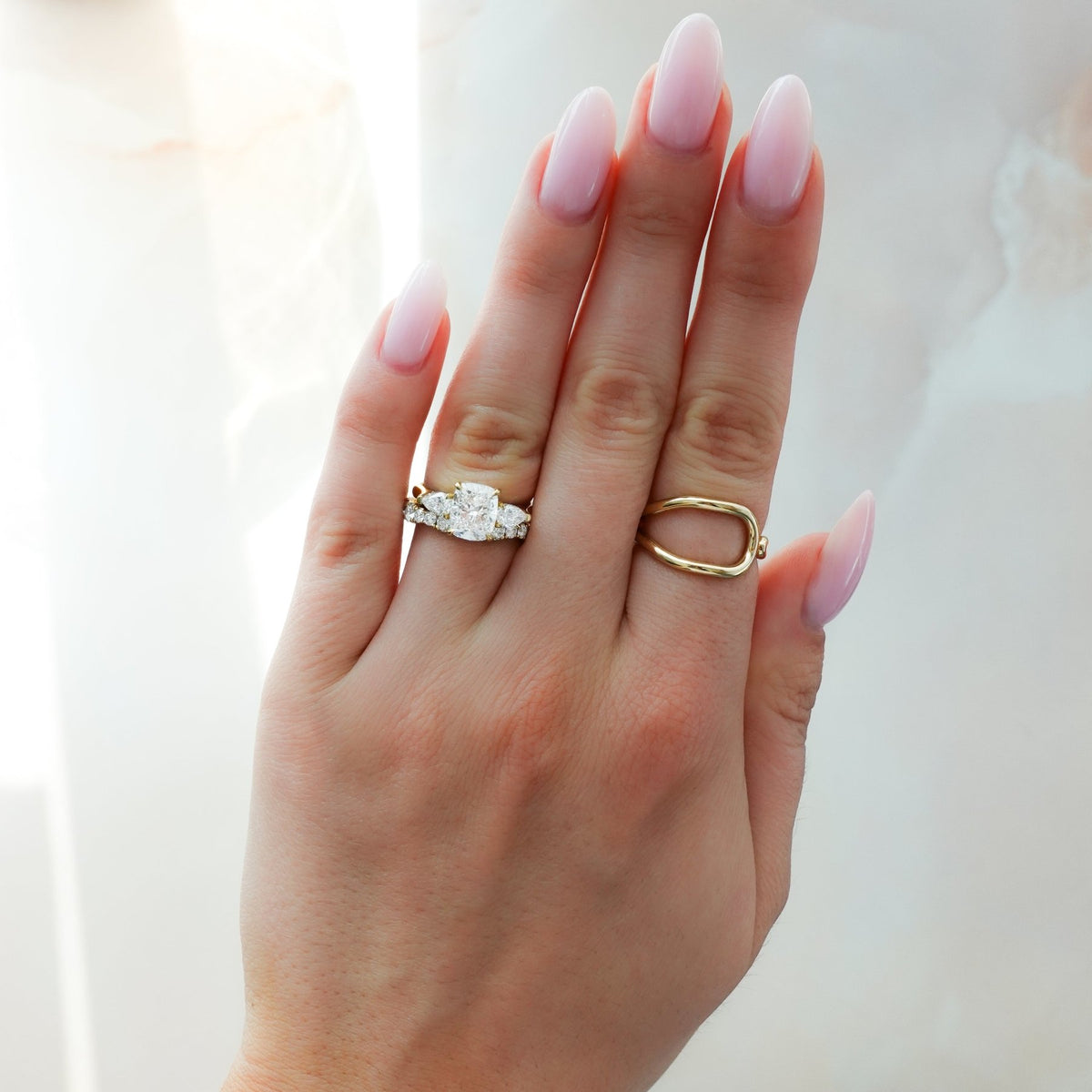 Three Stone Engagement Ring With Pear Side Stones and Elongated Cushion Cut Diamond - GOODSTONE