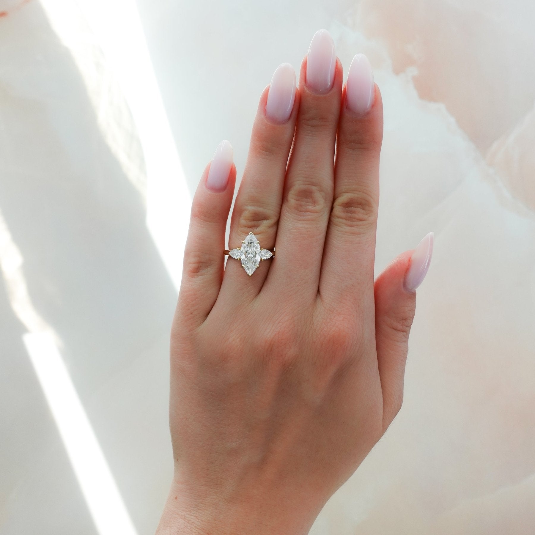 Three Stone Engagement Ring With Pear Side Stones and Marquise Cut Dia