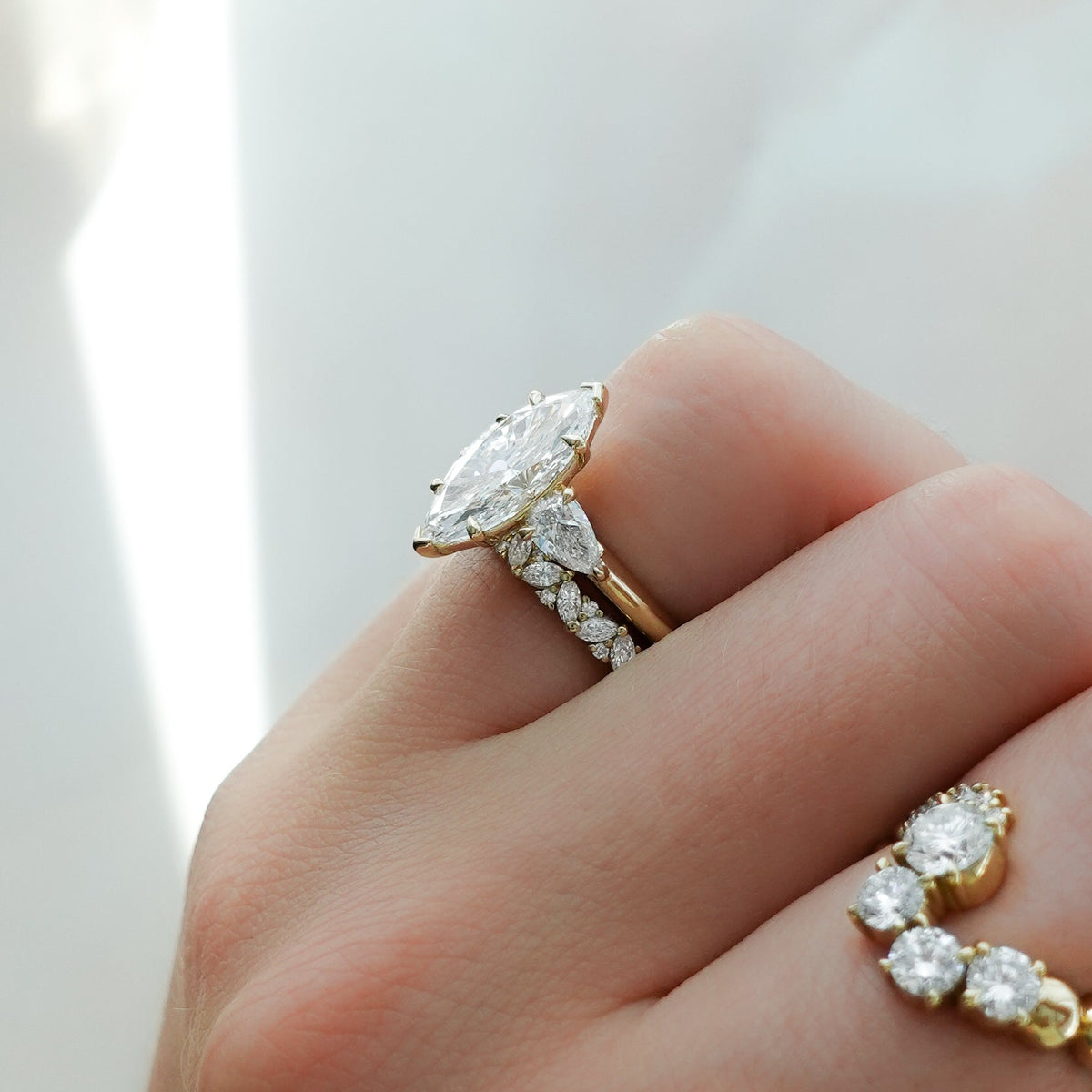 Three Stone Engagement Ring With Pear Side Stones and Marquise Cut Diamond - GOODSTONE