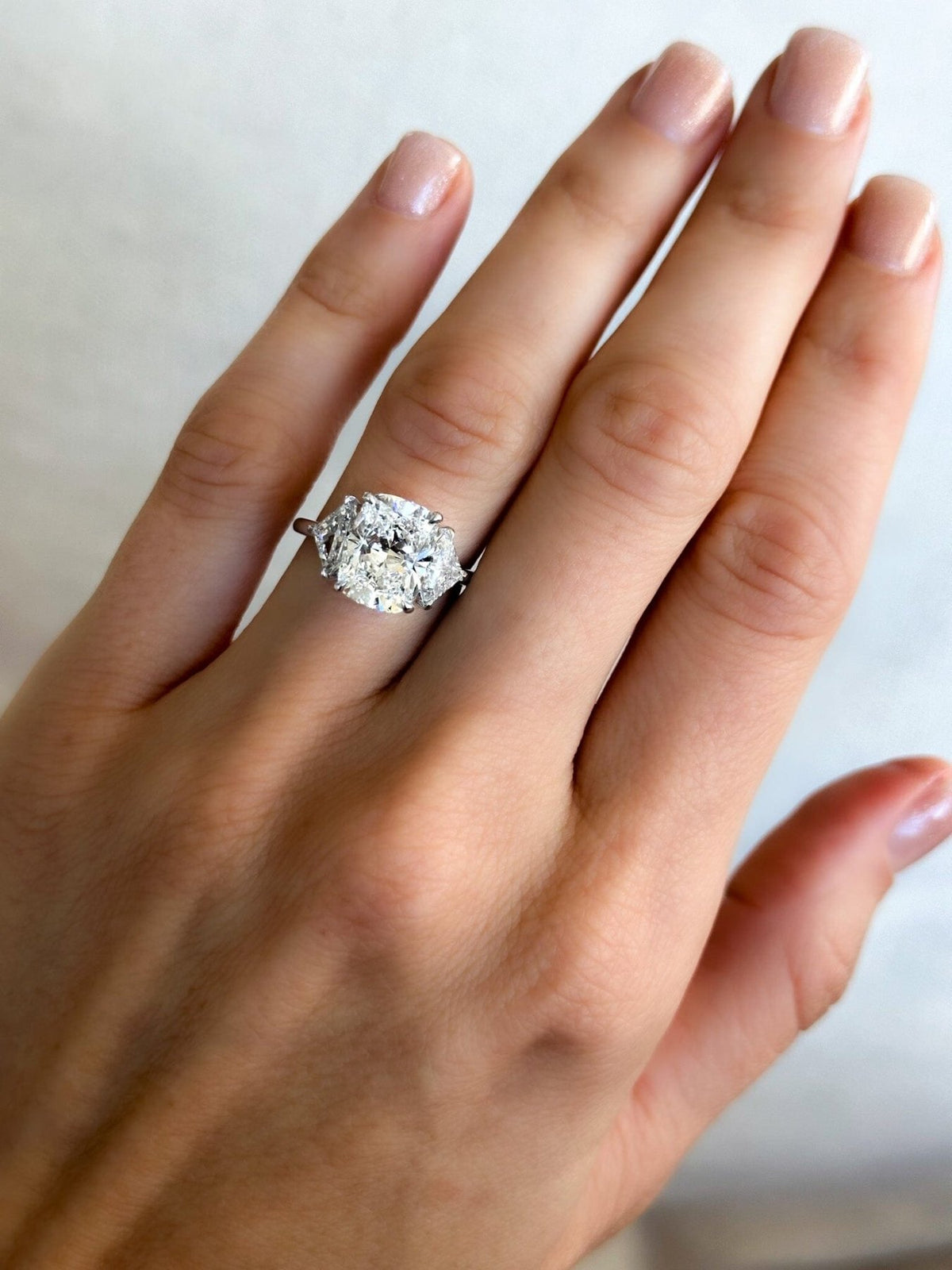 Three Stone Engagement Ring with Shield Side Stones and an Elongated Cushion cut Diamond - GOODSTONE