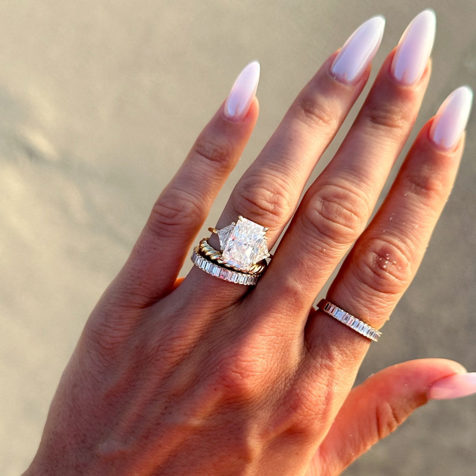 Three Stone Engagement Ring with Shield Side Stones and an Elongated Radiant cut Diamond - GOODSTONE