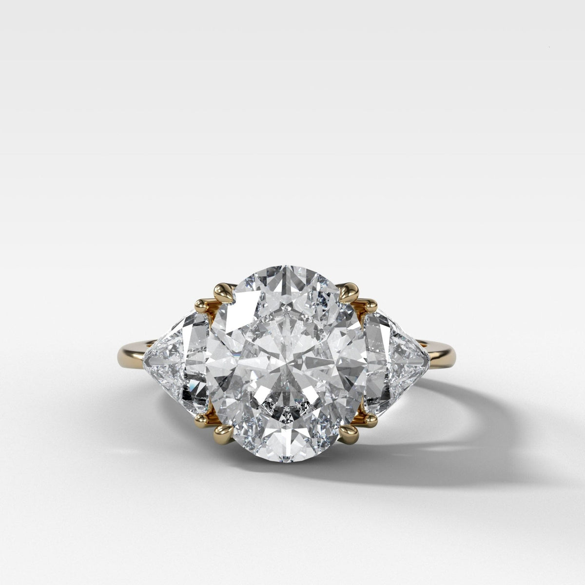 Three Stone Engagement Ring with Shield Side Stones and an Oval cut Diamond - GOODSTONE
