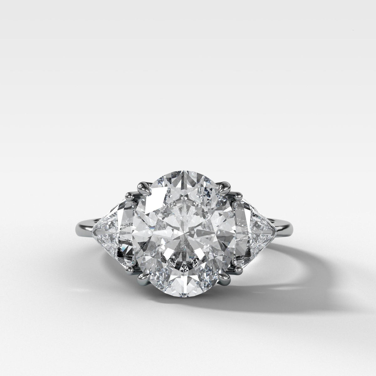 Three Stone Engagement Ring with Shield Side Stones and an Oval cut Diamond - GOODSTONE