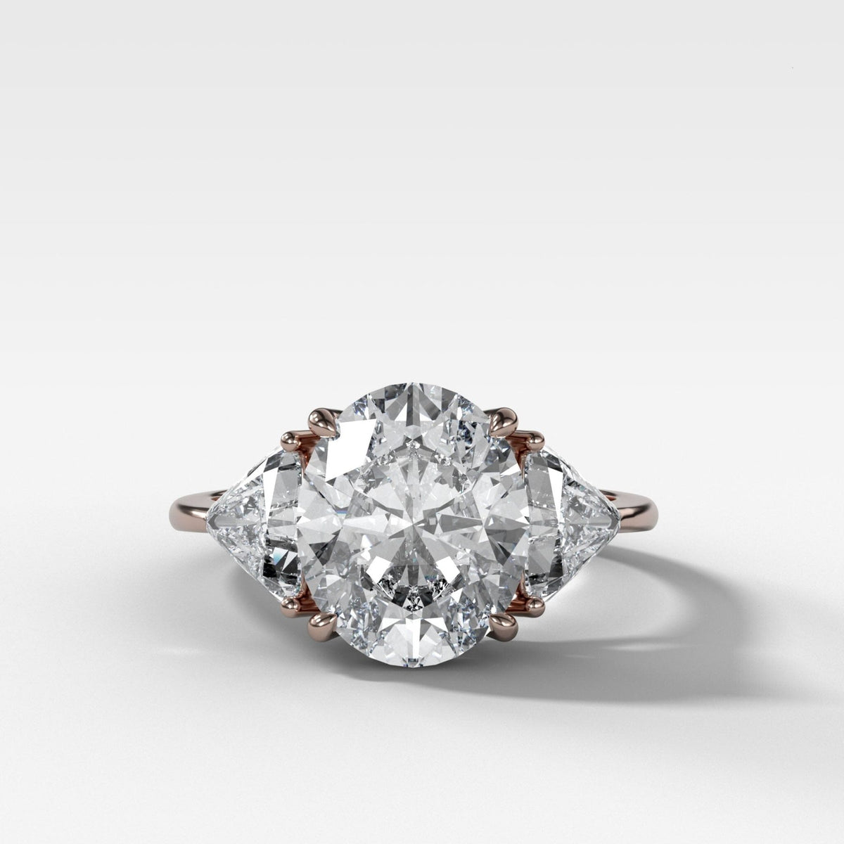 Three Stone Engagement Ring with Shield Side Stones and an Oval cut Diamond - GOODSTONE