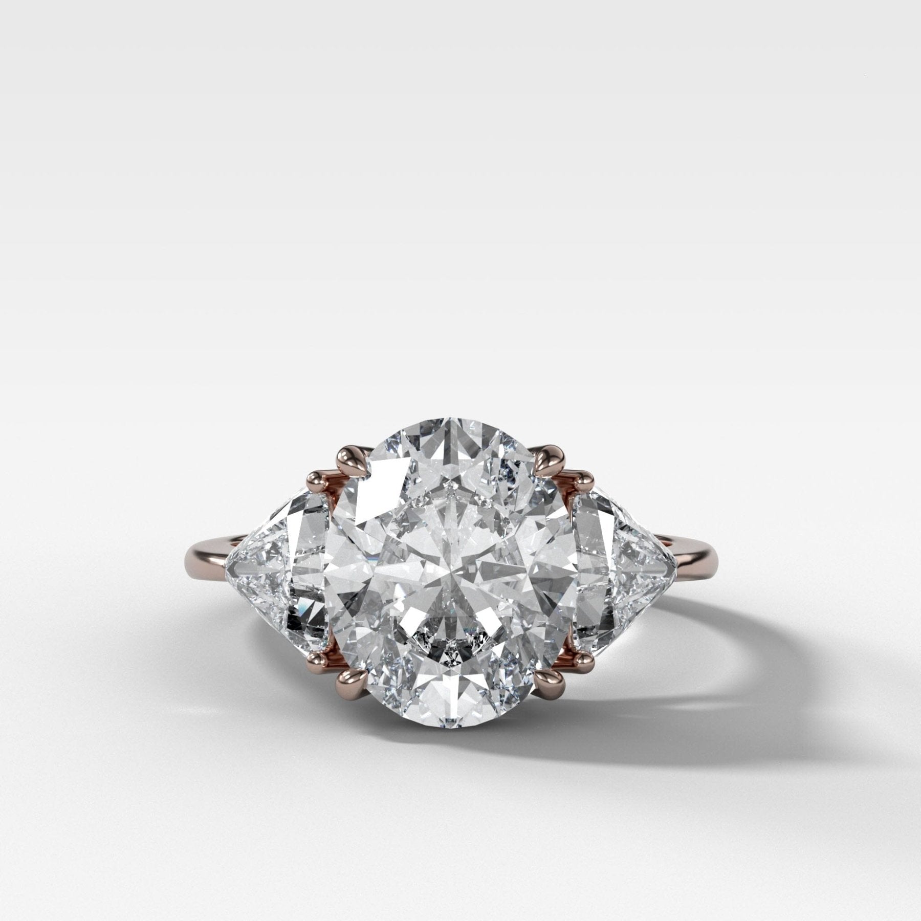 Three Stone ring with Shield Side Stones and an Oval cut | GOODSTONE