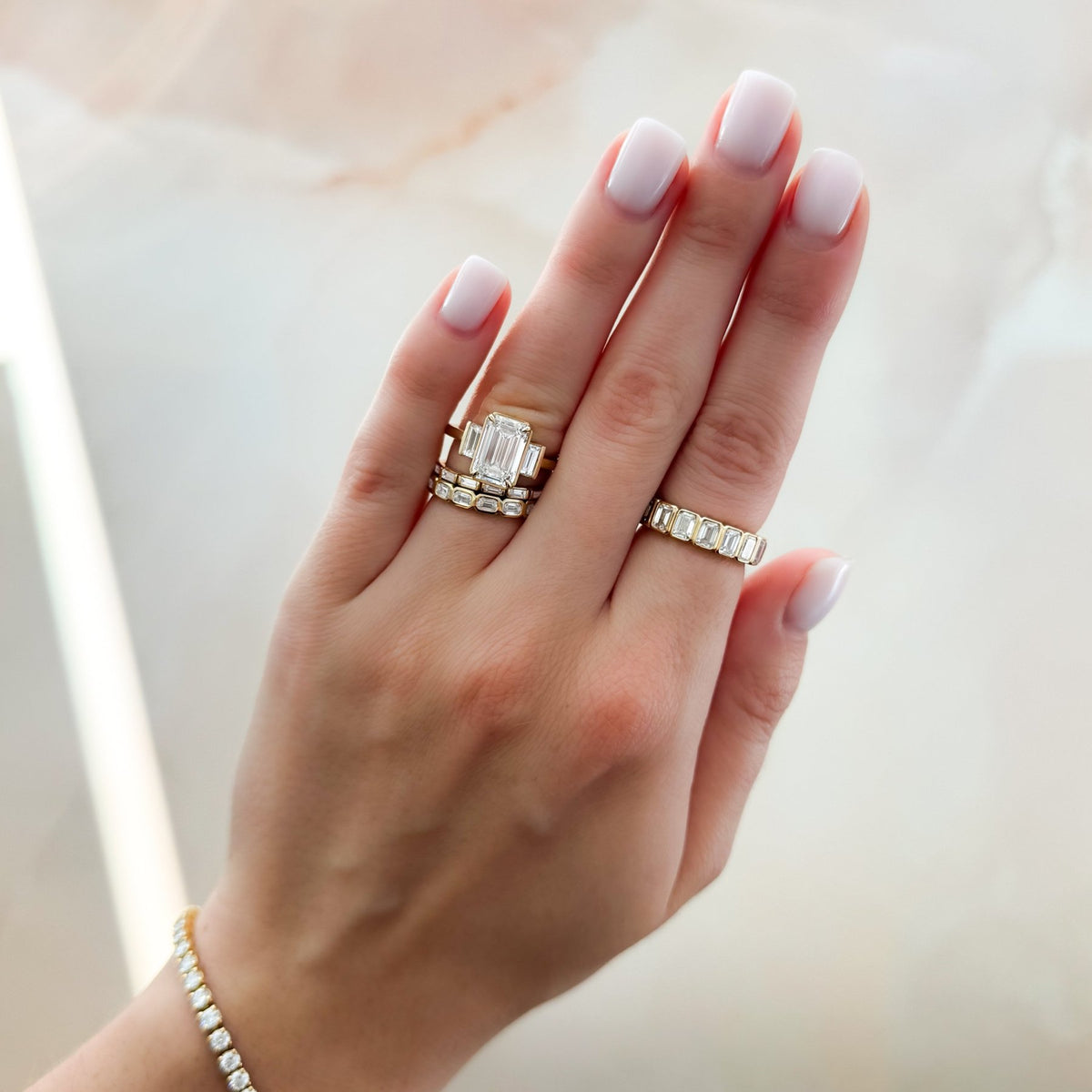 Three Stone Engagement Ring With Straight Baguette Side Stones and Emerald Cut Diamond - GOODSTONE